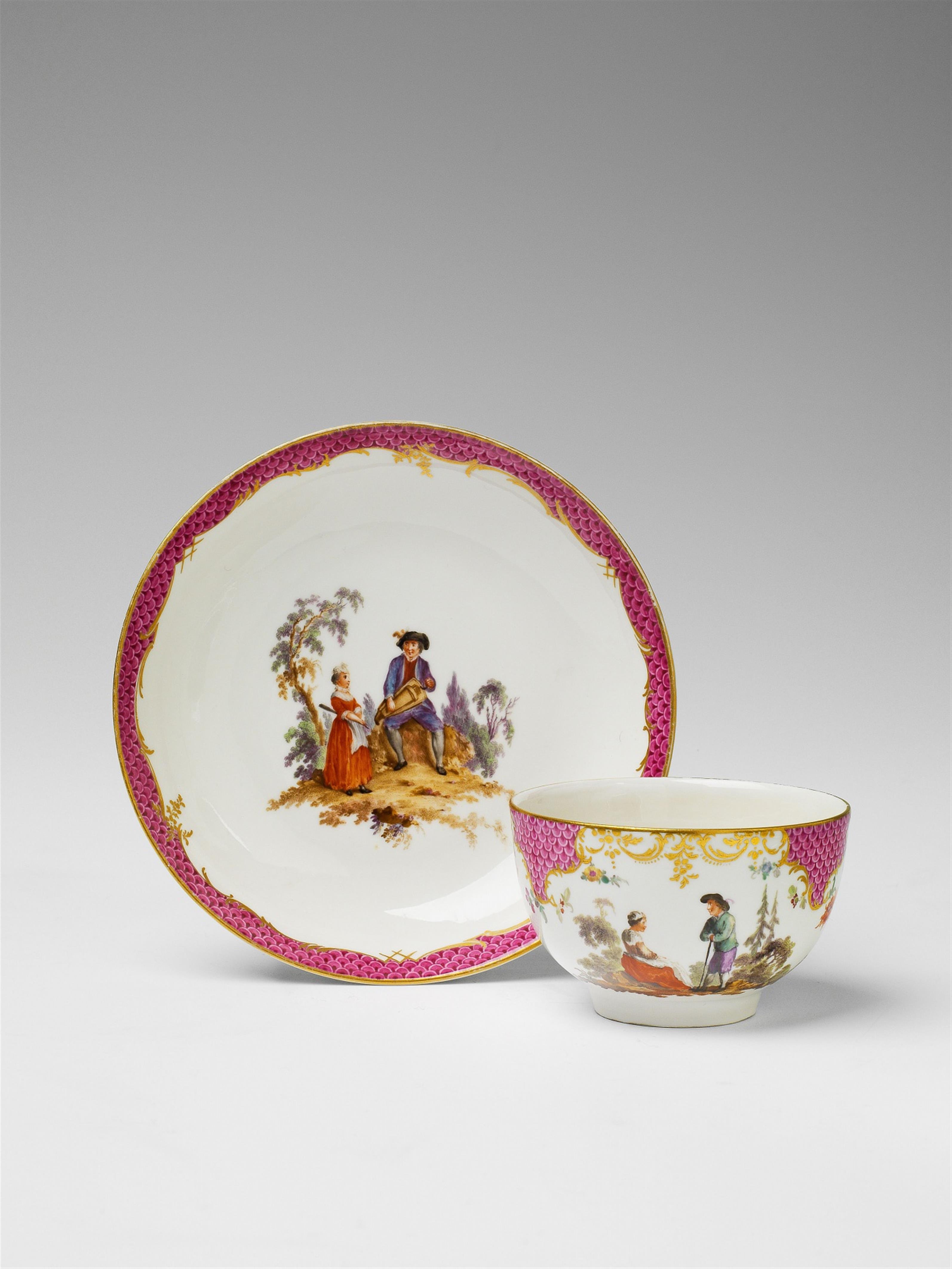 A Berlin KPM porcelain teacup and saucer with scenes after Teniers - image-1
