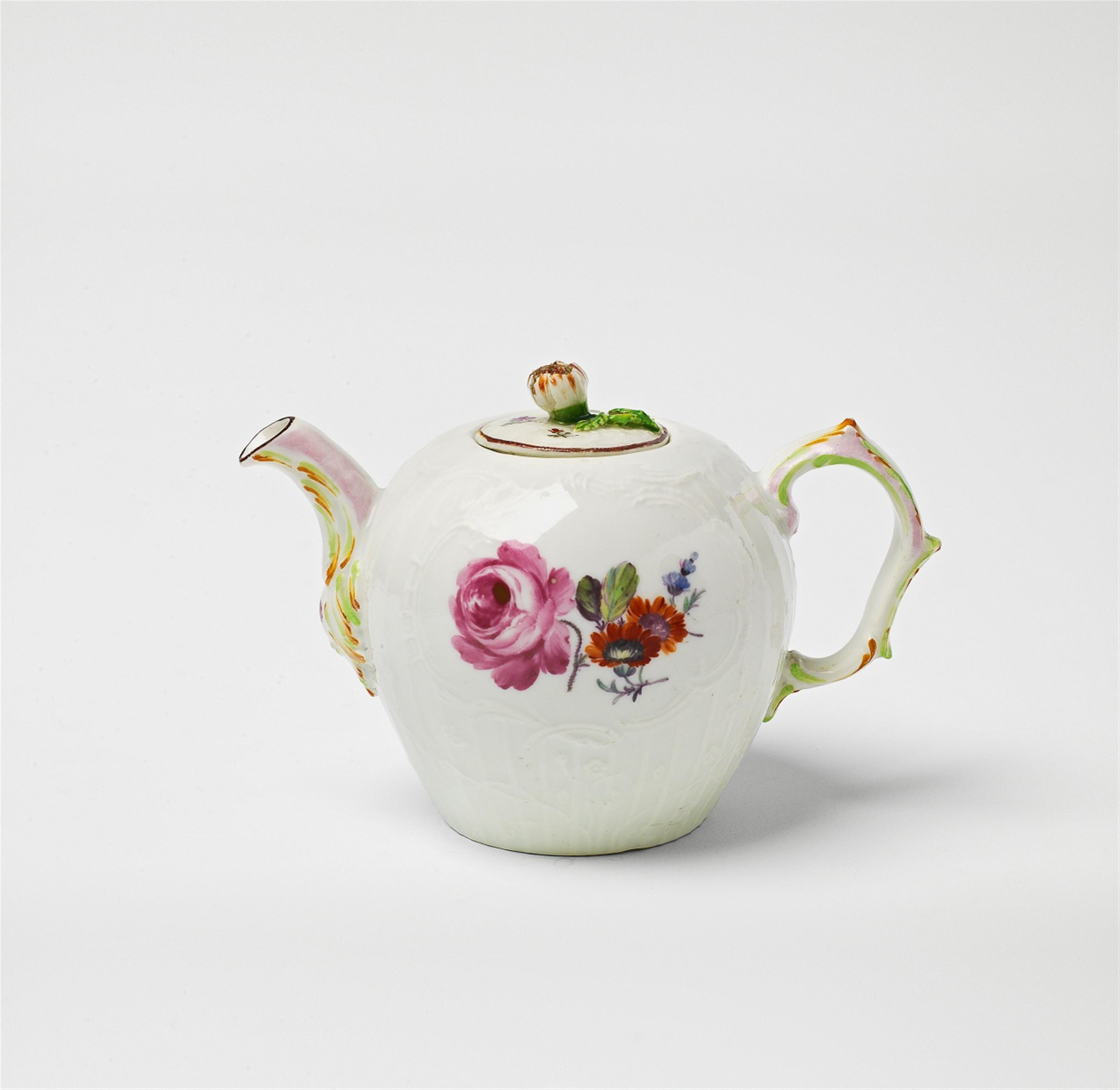 A small Berlin KPM porcelain teapot with naturalistic floral decor - image-1