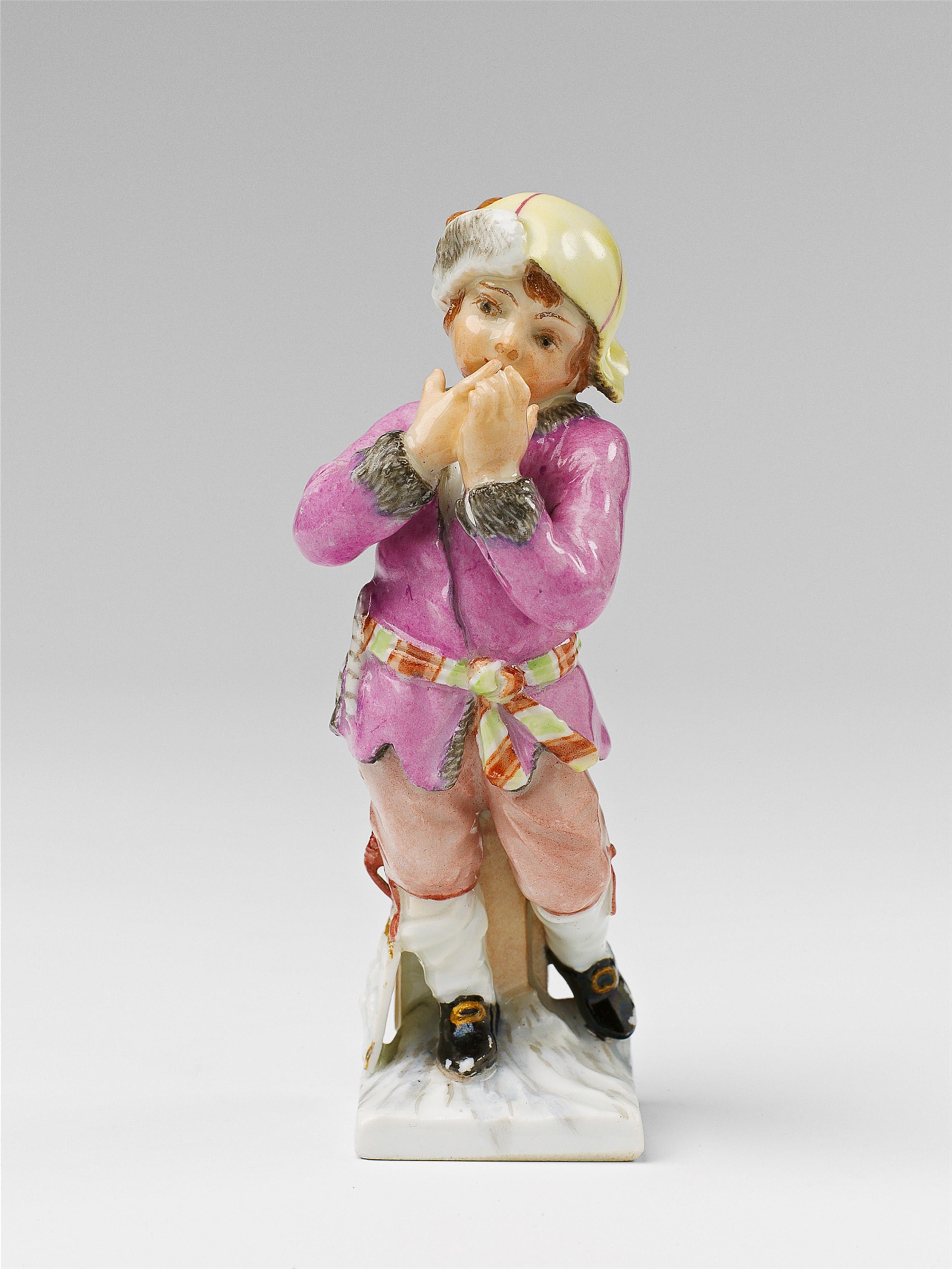 A Berlin KPM allegorical porcelain figure of a boy as January - image-1