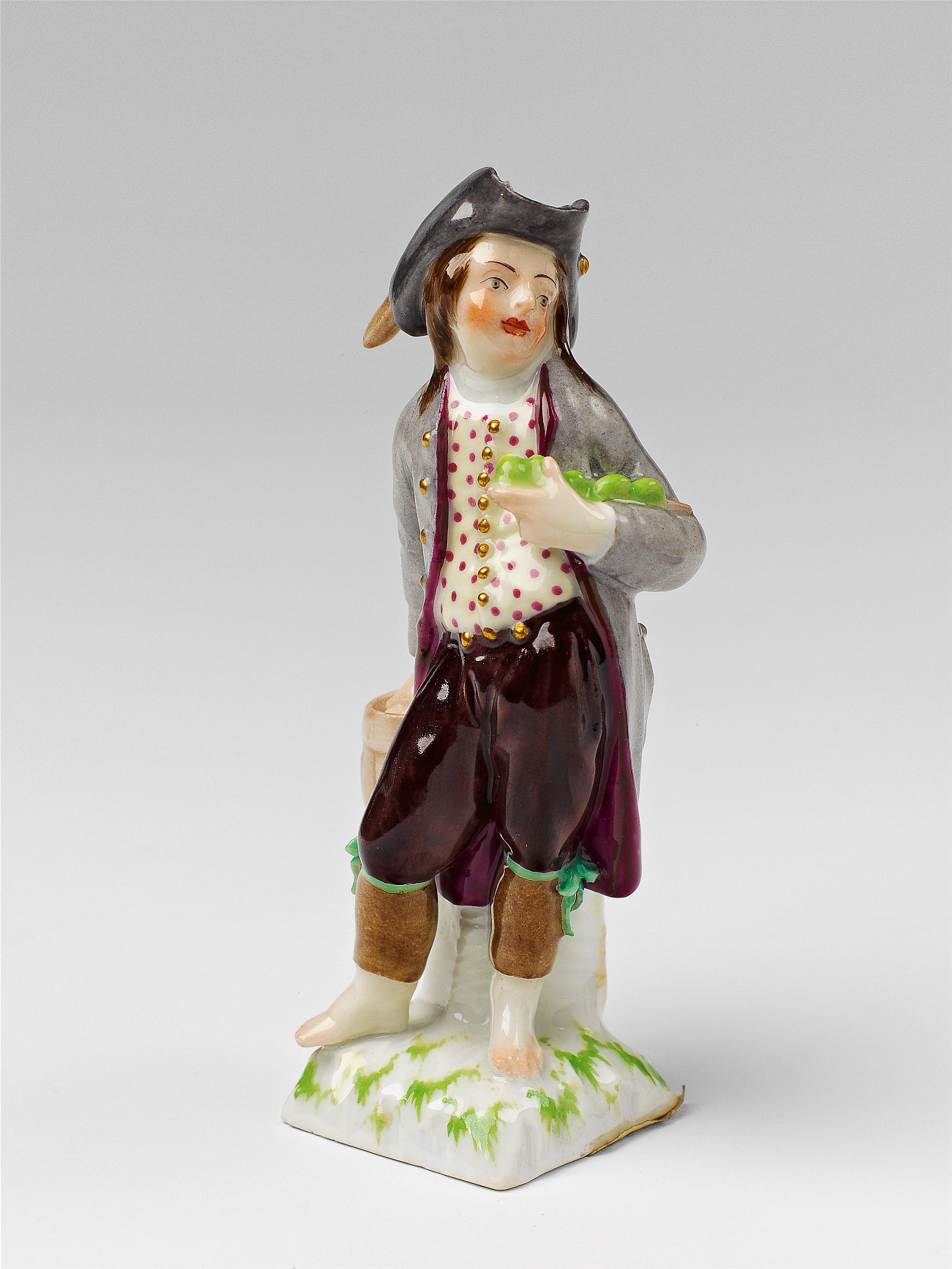 A Berlin KPM porcelain figure of a boy as a dill pickle seller - image-1