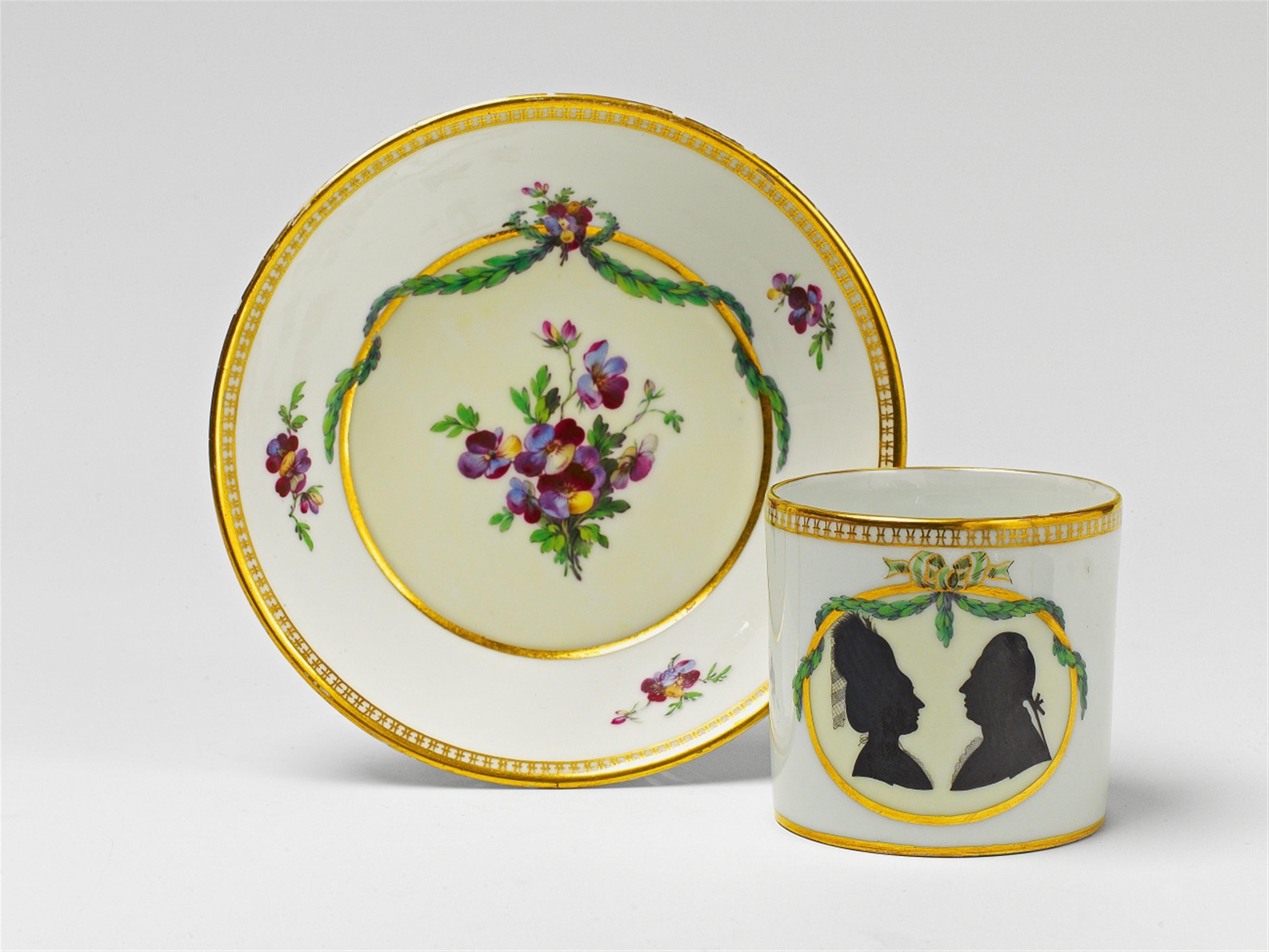 A Berlin KPM porcelain cup and saucer with a silhouetted couple - image-2