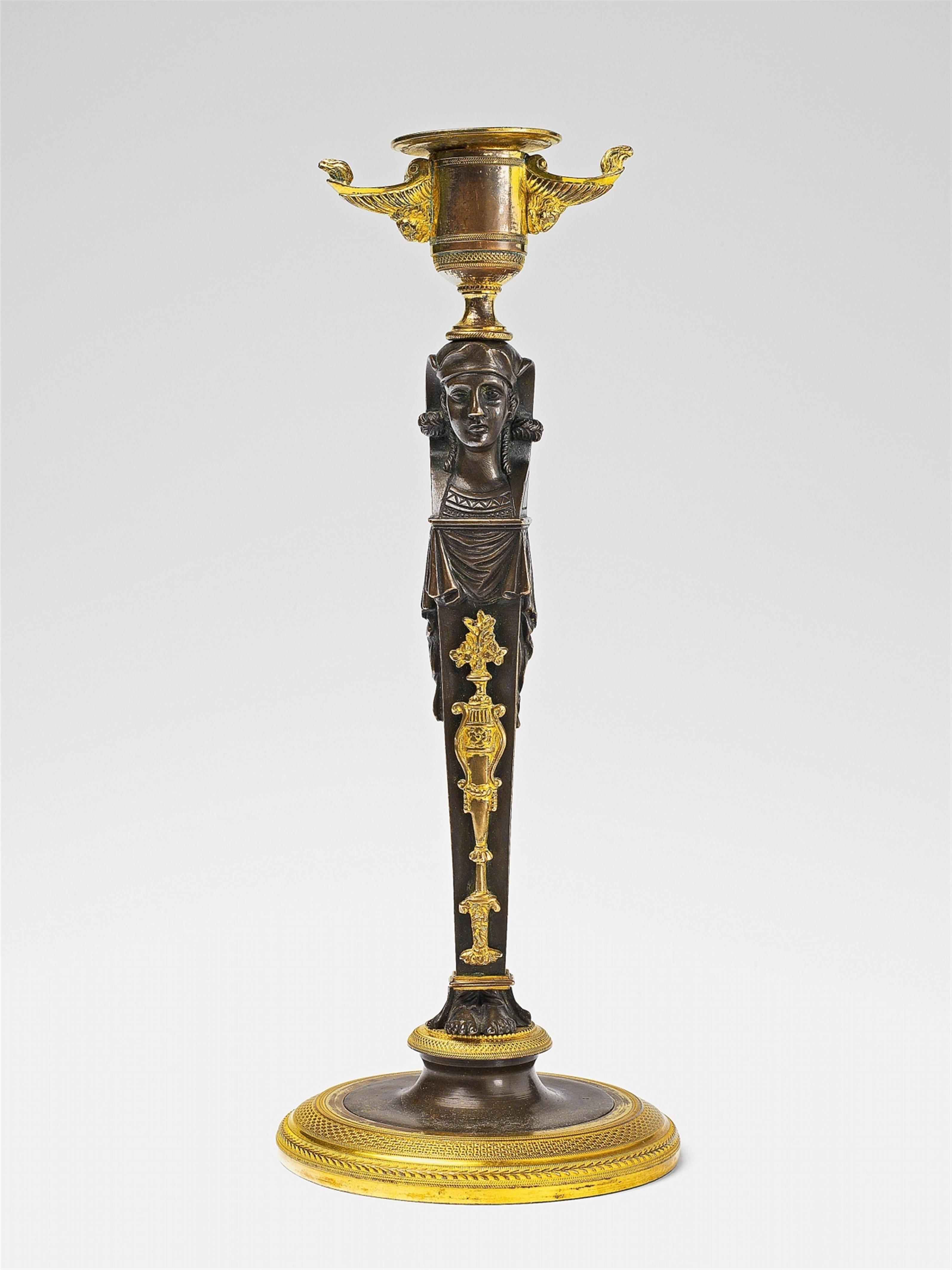 An ormolu candlestick in the Egyptian taste - image-1