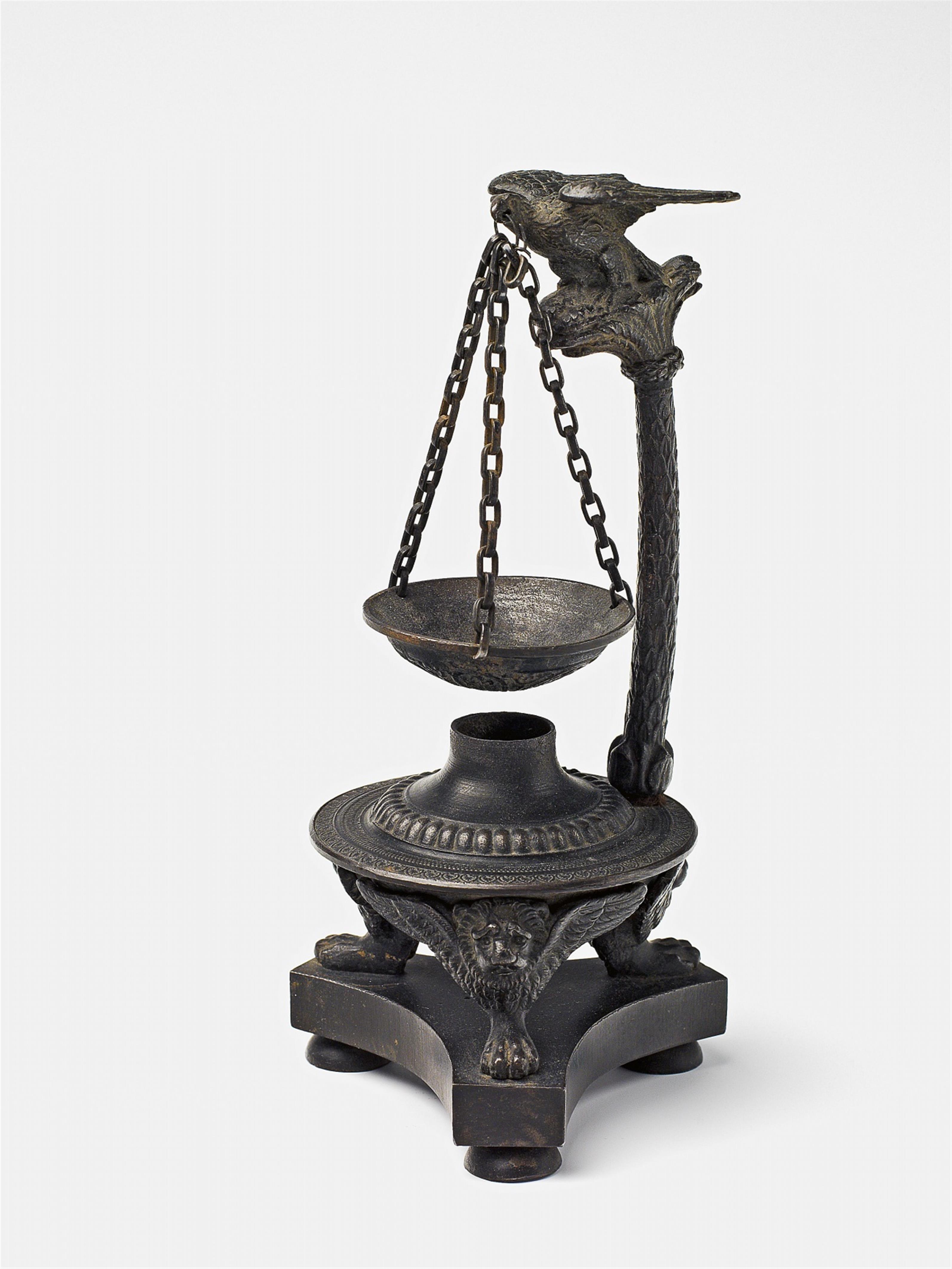 A cast iron incense burner with an eagle - image-1
