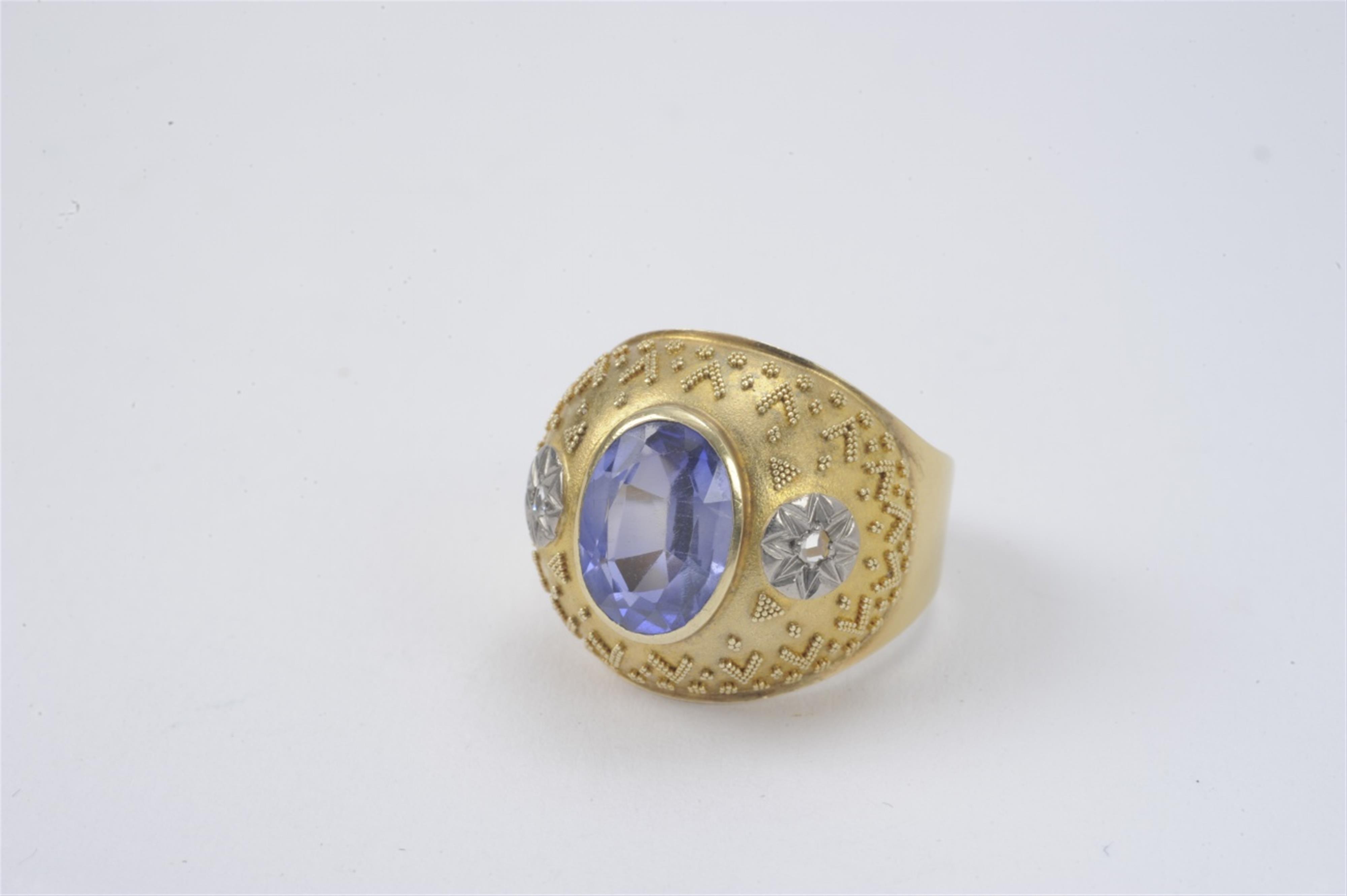 A German 14k gold and sapphire ring - image-1