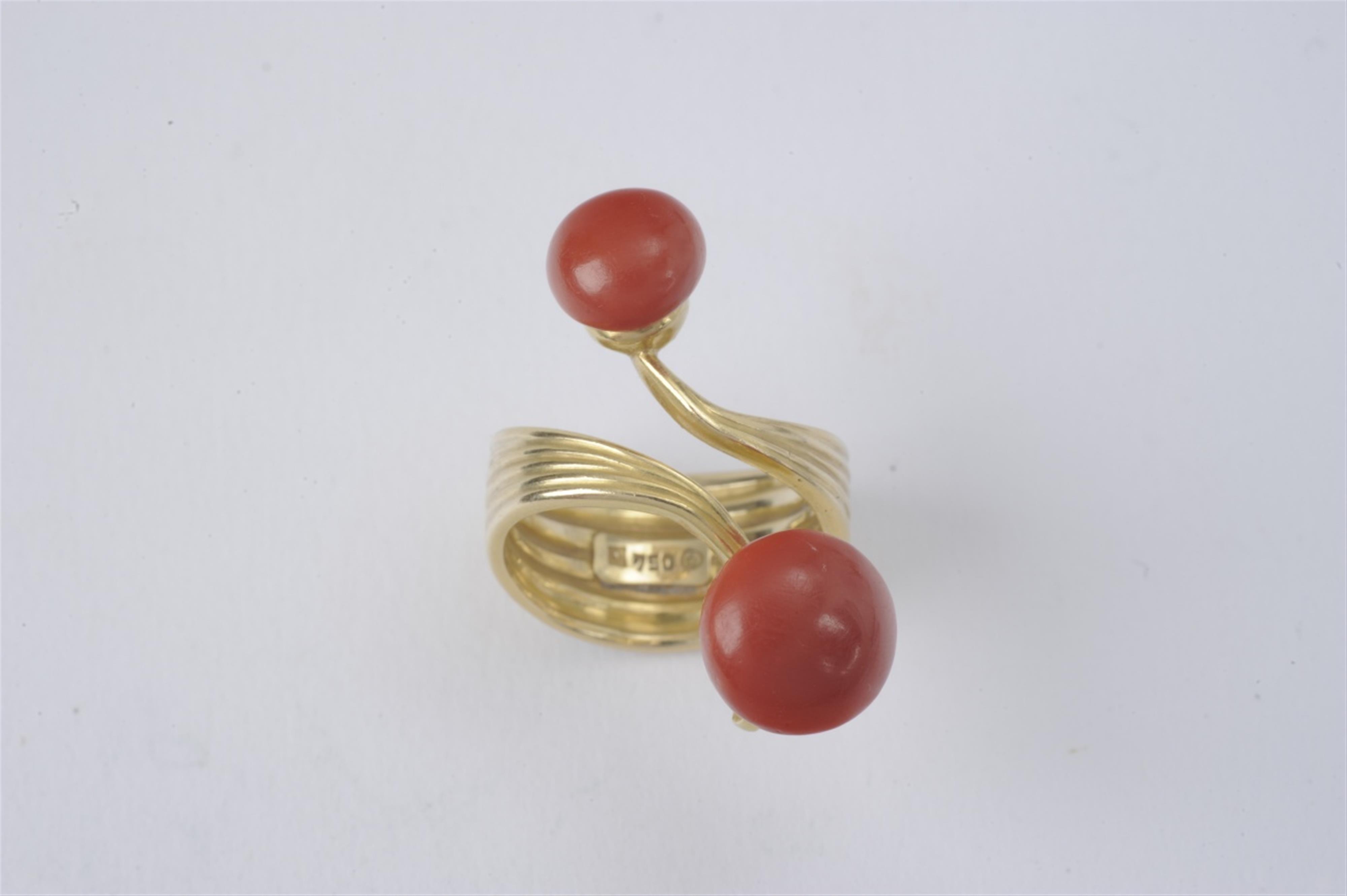 An 18k gold and coral crossover ring made by Wilhelm Nagel - image-1