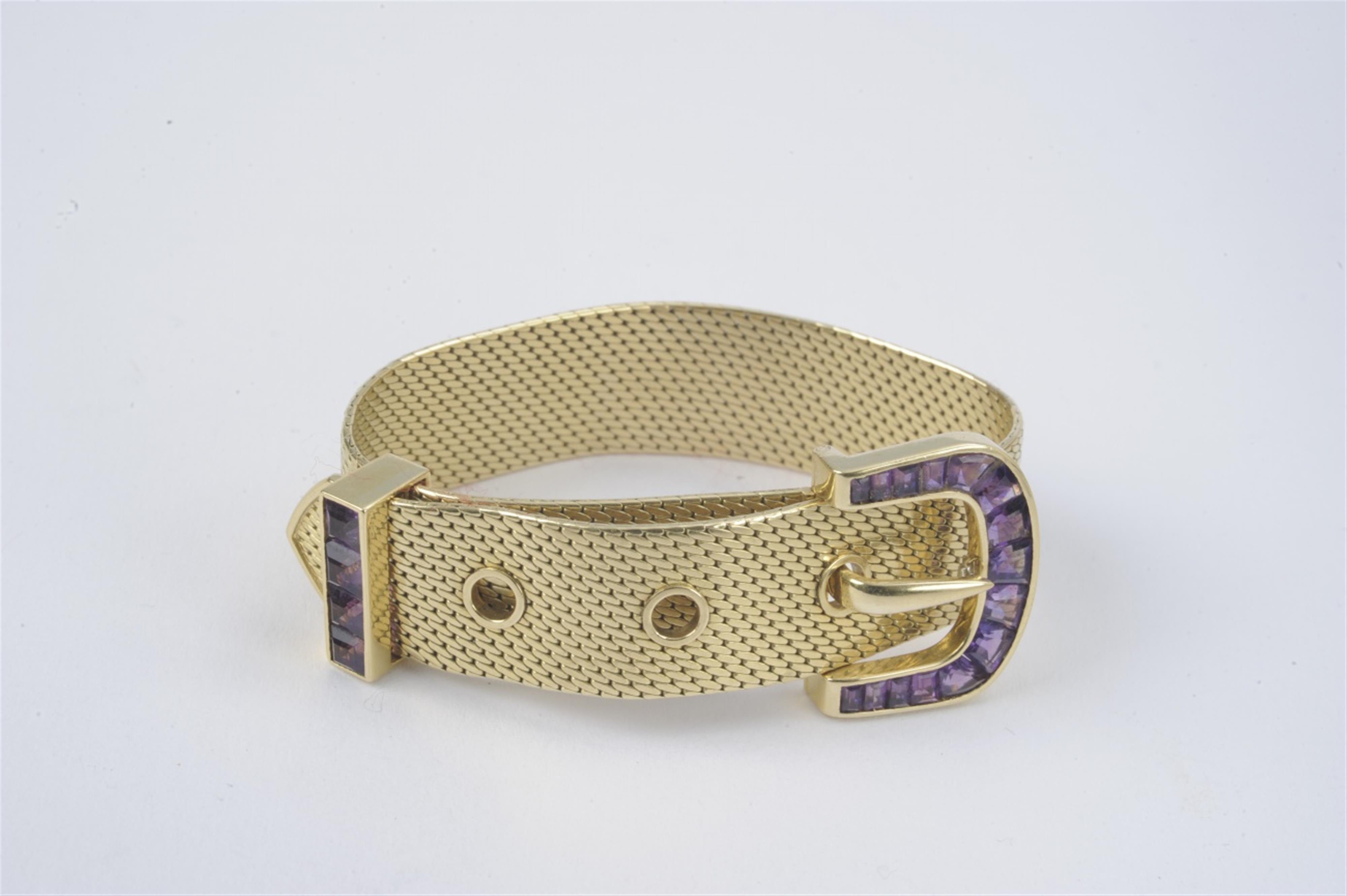 An 18k gold bracelet formed as a belt - image-1