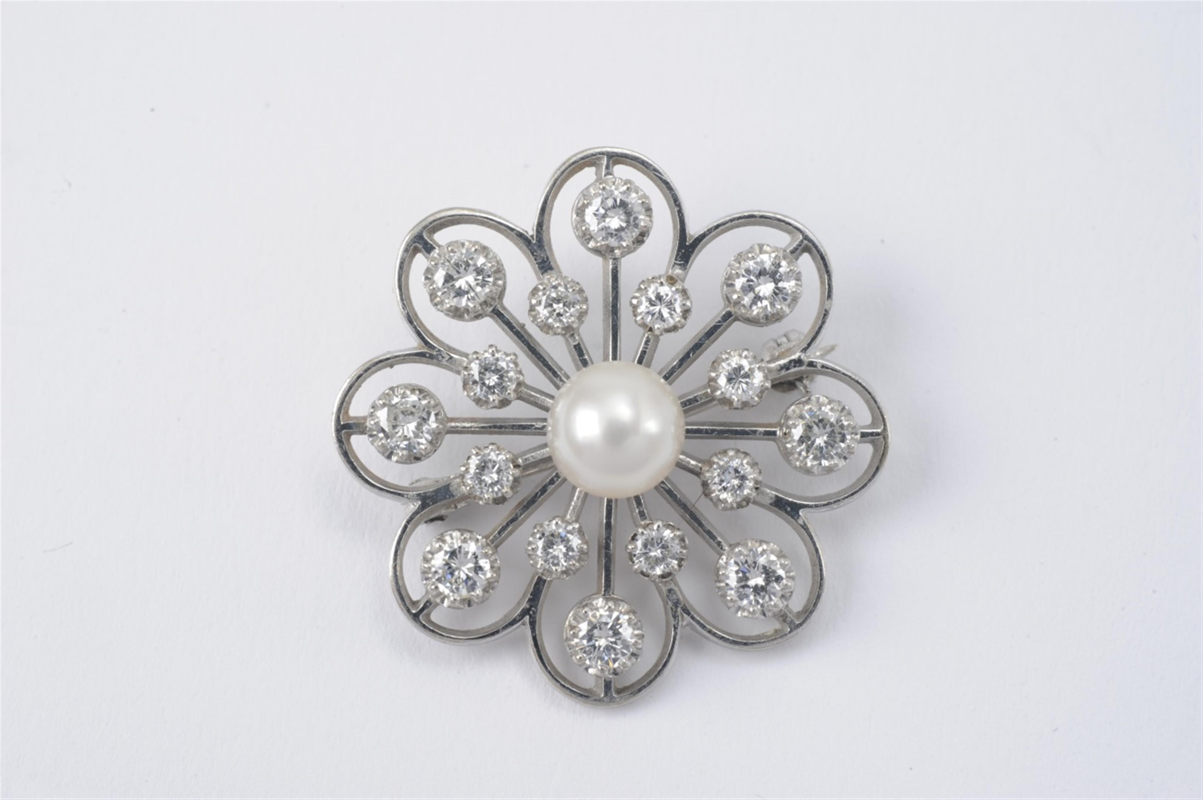 A 14k white gold and diamond rosette brooch - image-1