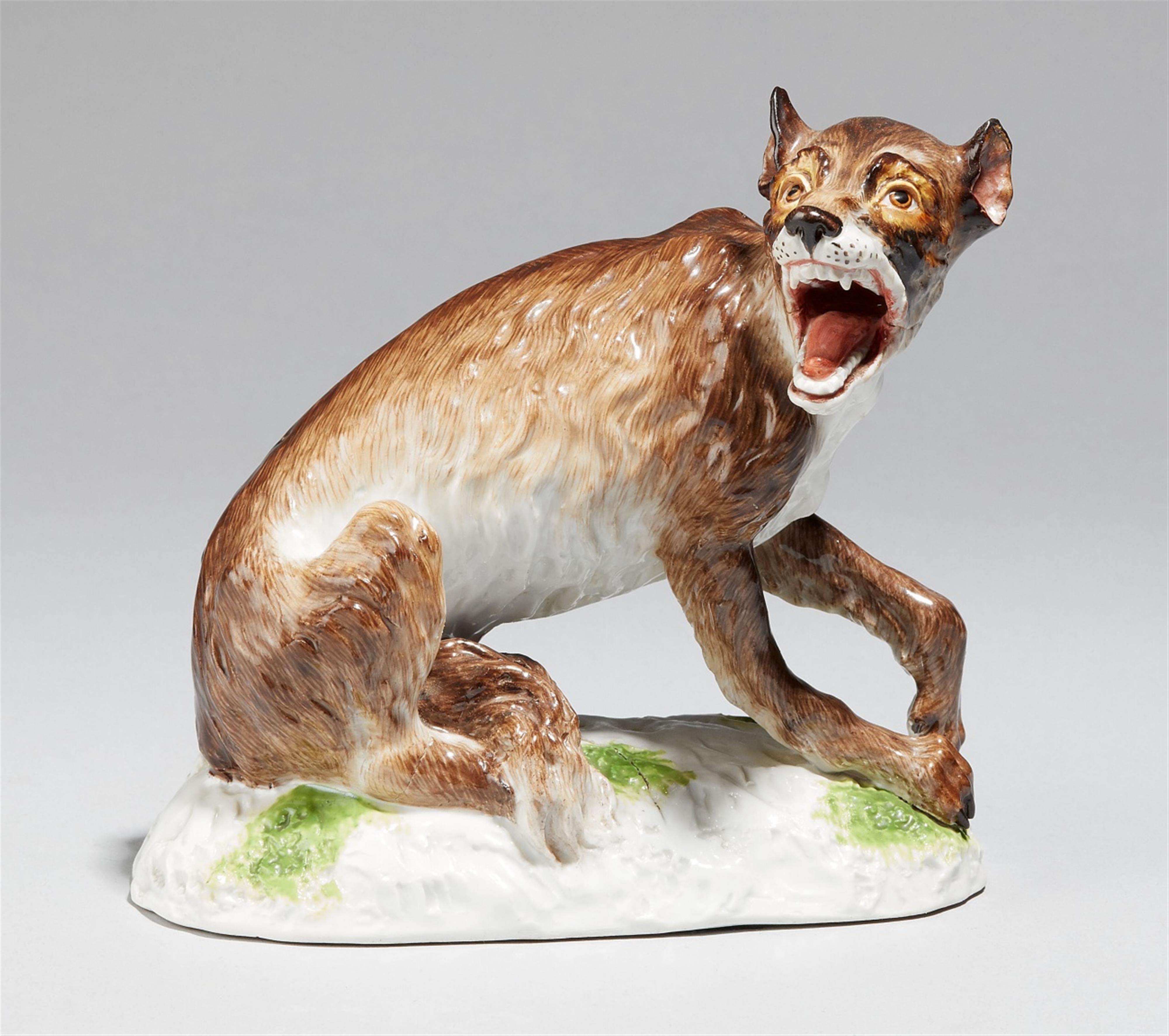 A Meissen porcelain model of a seated wolf - image-1