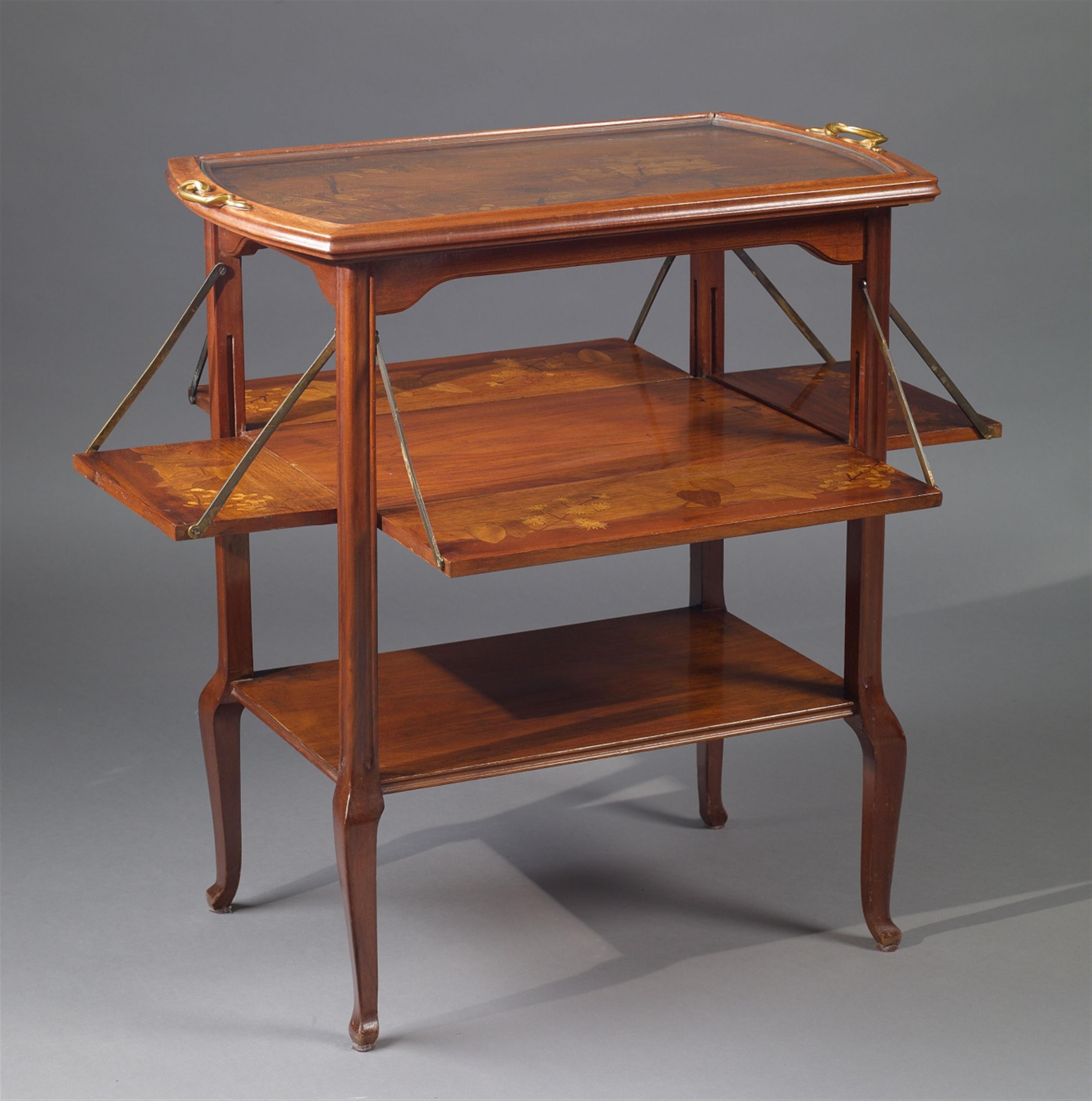 A bronze-mounted Louis Majorelle mahogany and satinwood tea table - image-1