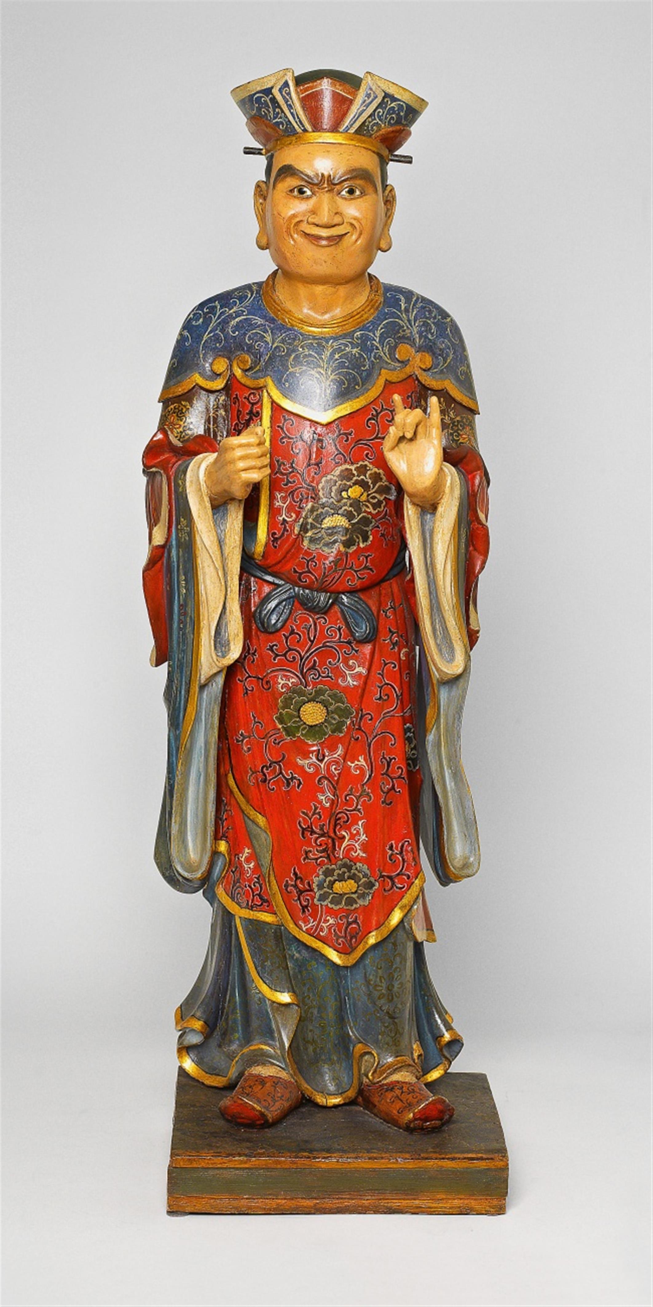 A carved pinewood figure of a Chinese man - image-1