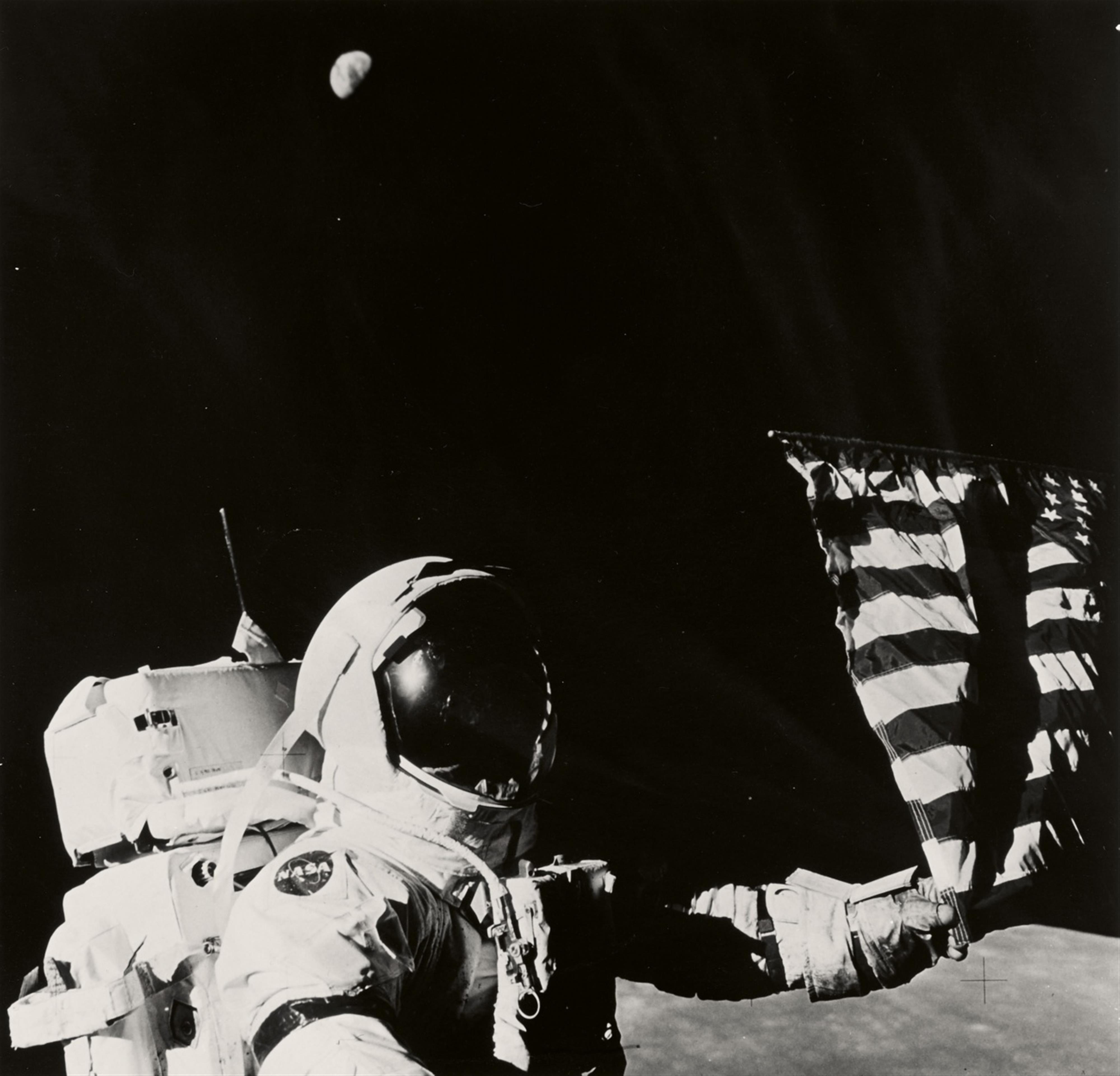 NASA - Apollo 17, Astronaut Eugene A. Cernan adjusts the flag planted on the Moon - image-1