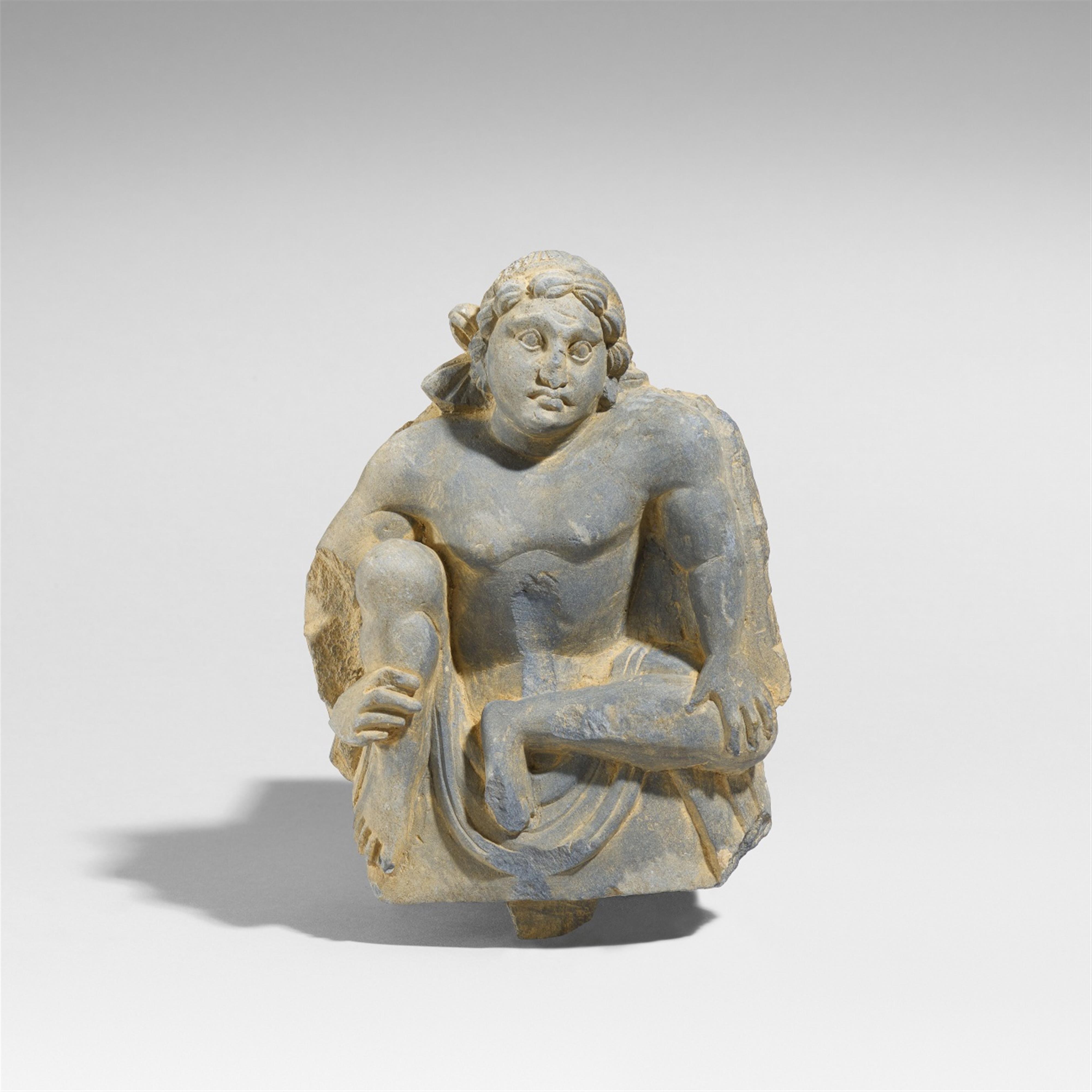 A Gandhara grey schist fragment of a panel with an atlas. 2nd/3rd century - image-1