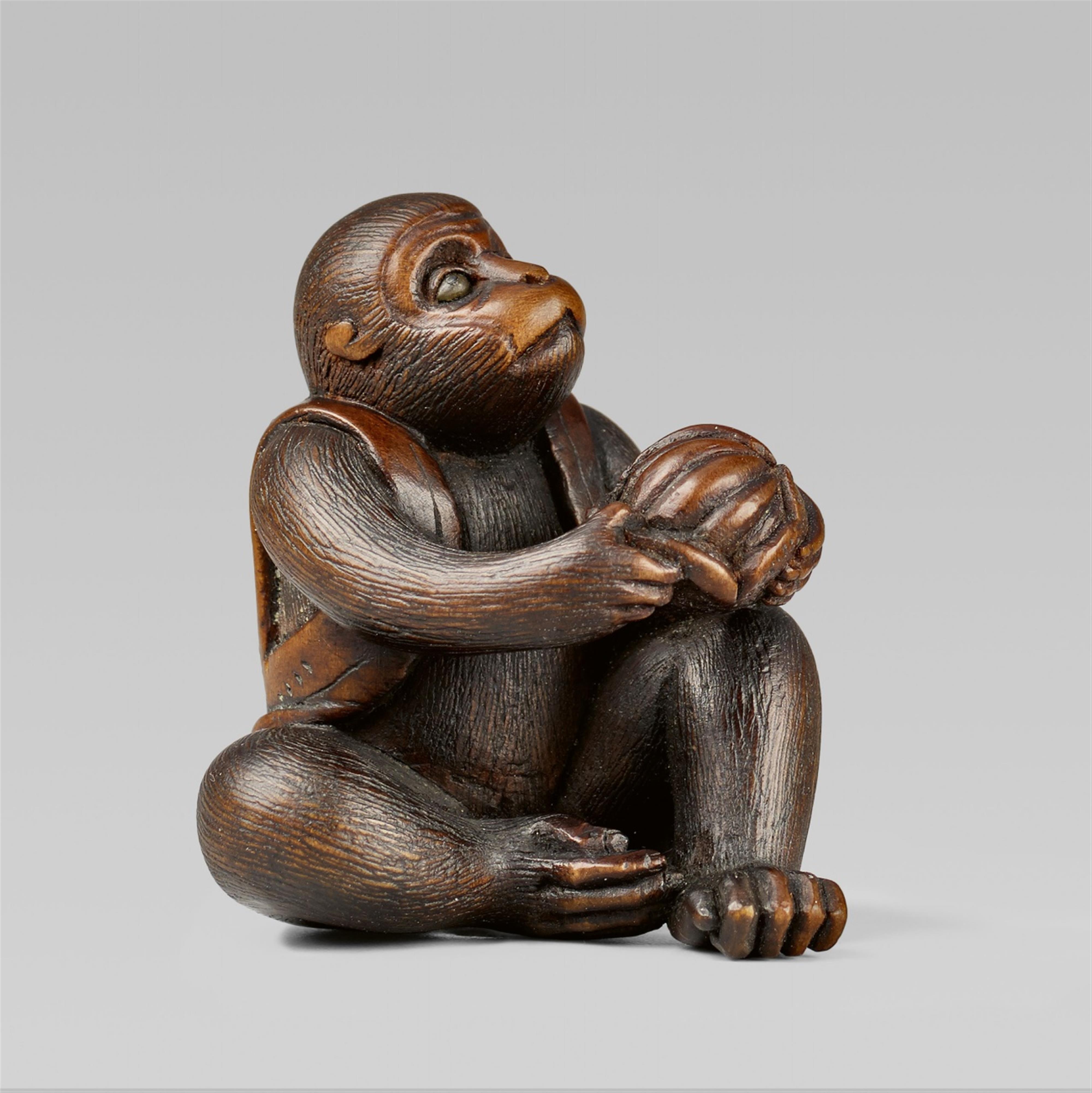 A fine boxwood netsuke of a monkey with a mikan, by Masatami. Second half 19th century - image-1