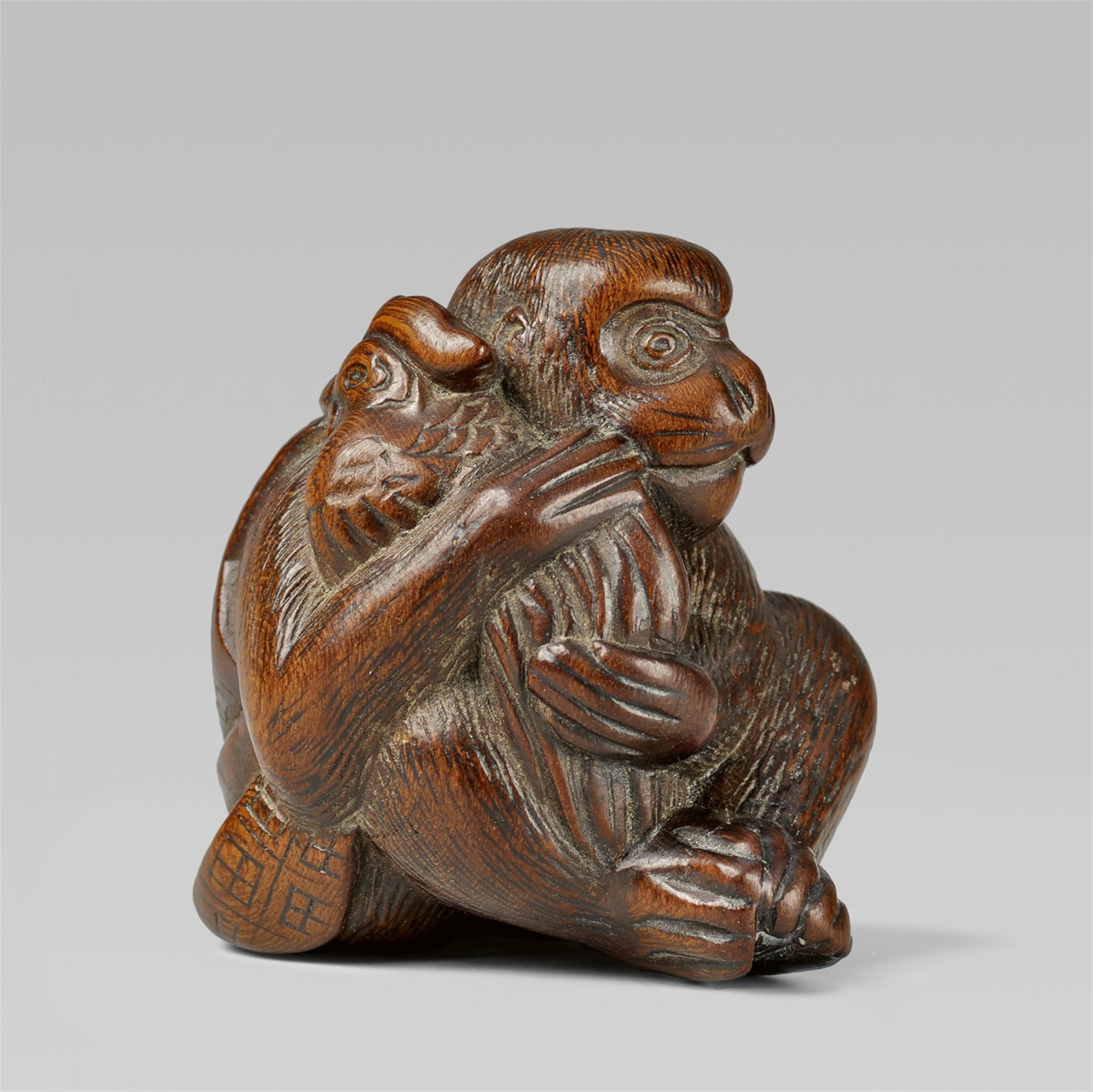 A wood netsuke of a monkey with a rooster. 19th century - image-1