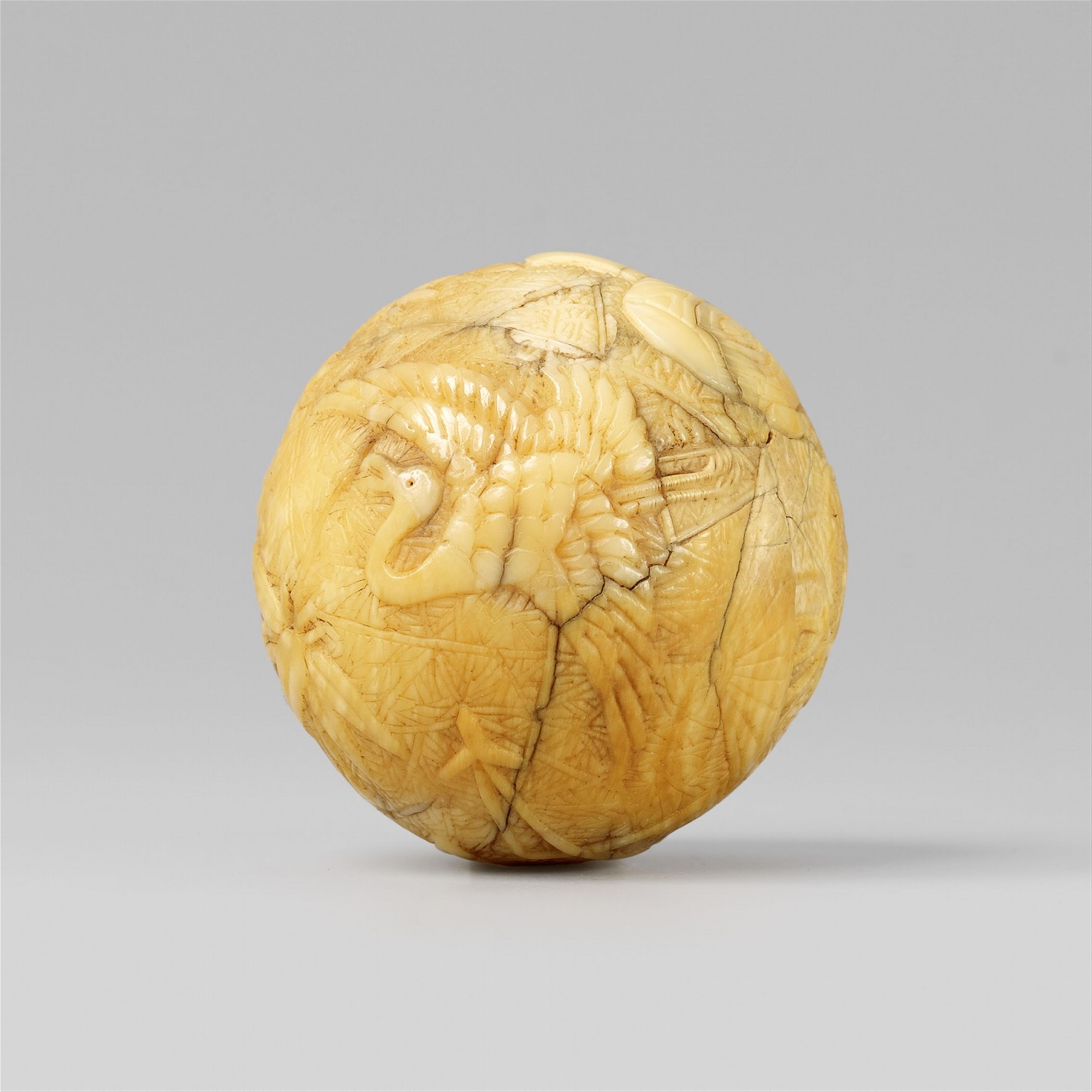 An unusual spherical ivory netsuke with New Year’s emblems and takaramono. Late 18th/early 19th century - image-1
