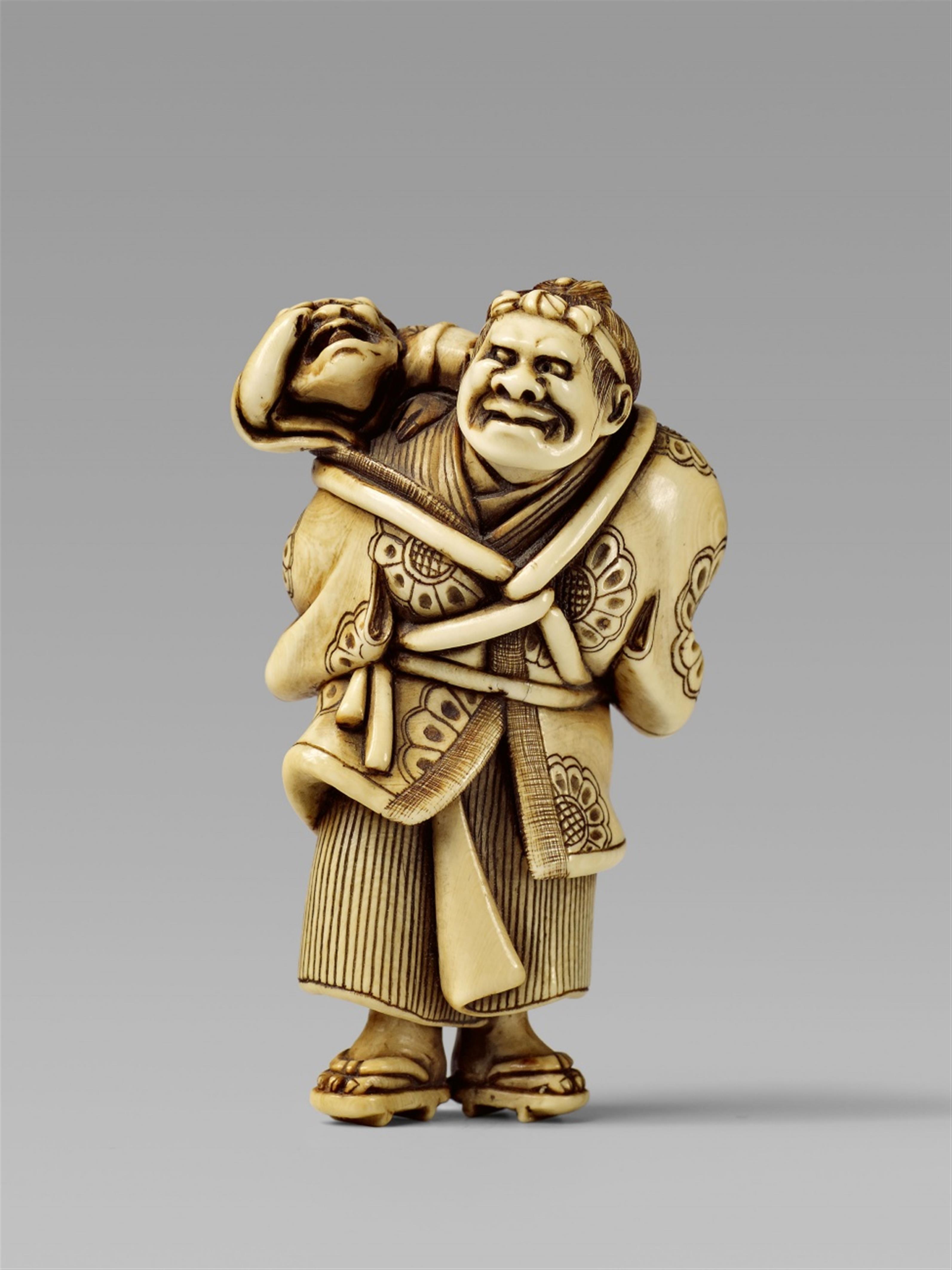 AN ivory netsuke of a demon and an oni. Late 19th century - image-1