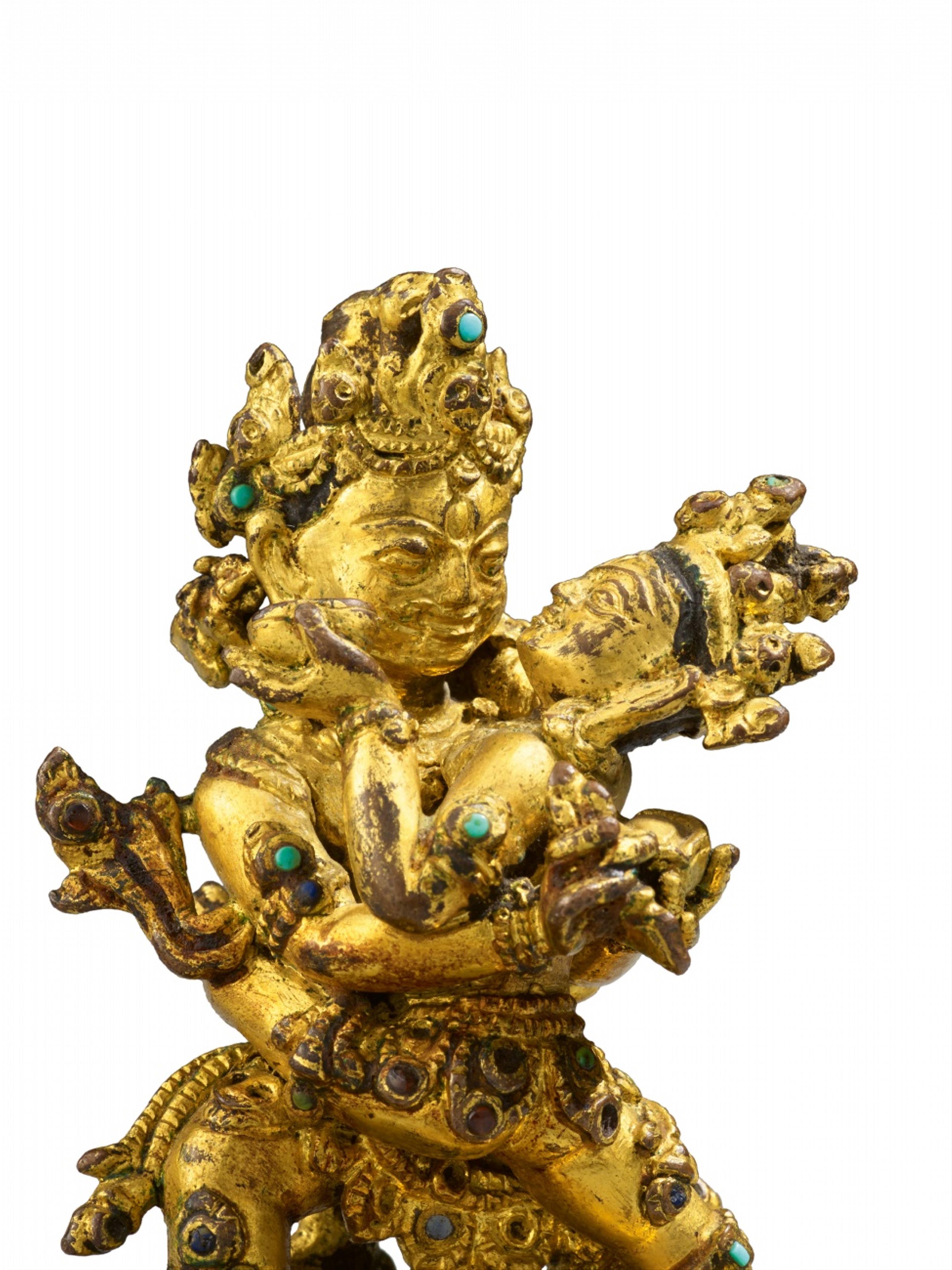 A rare Tibetan richly gilt bronze figure of Mahakala yab-yum. Malla period, 14th/15th century - image-2