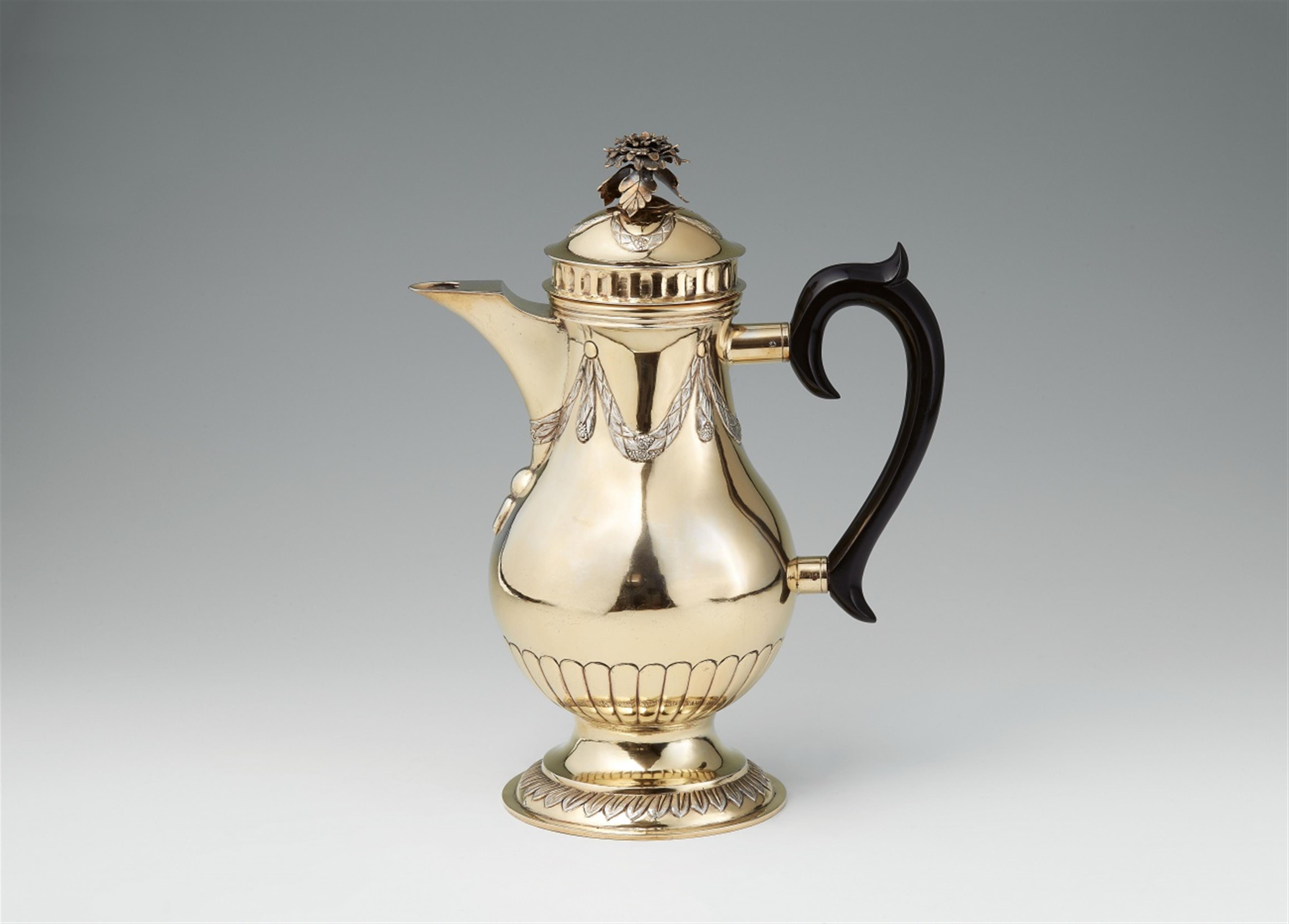 A large Neoclassical silver gilt coffee pot - image-1