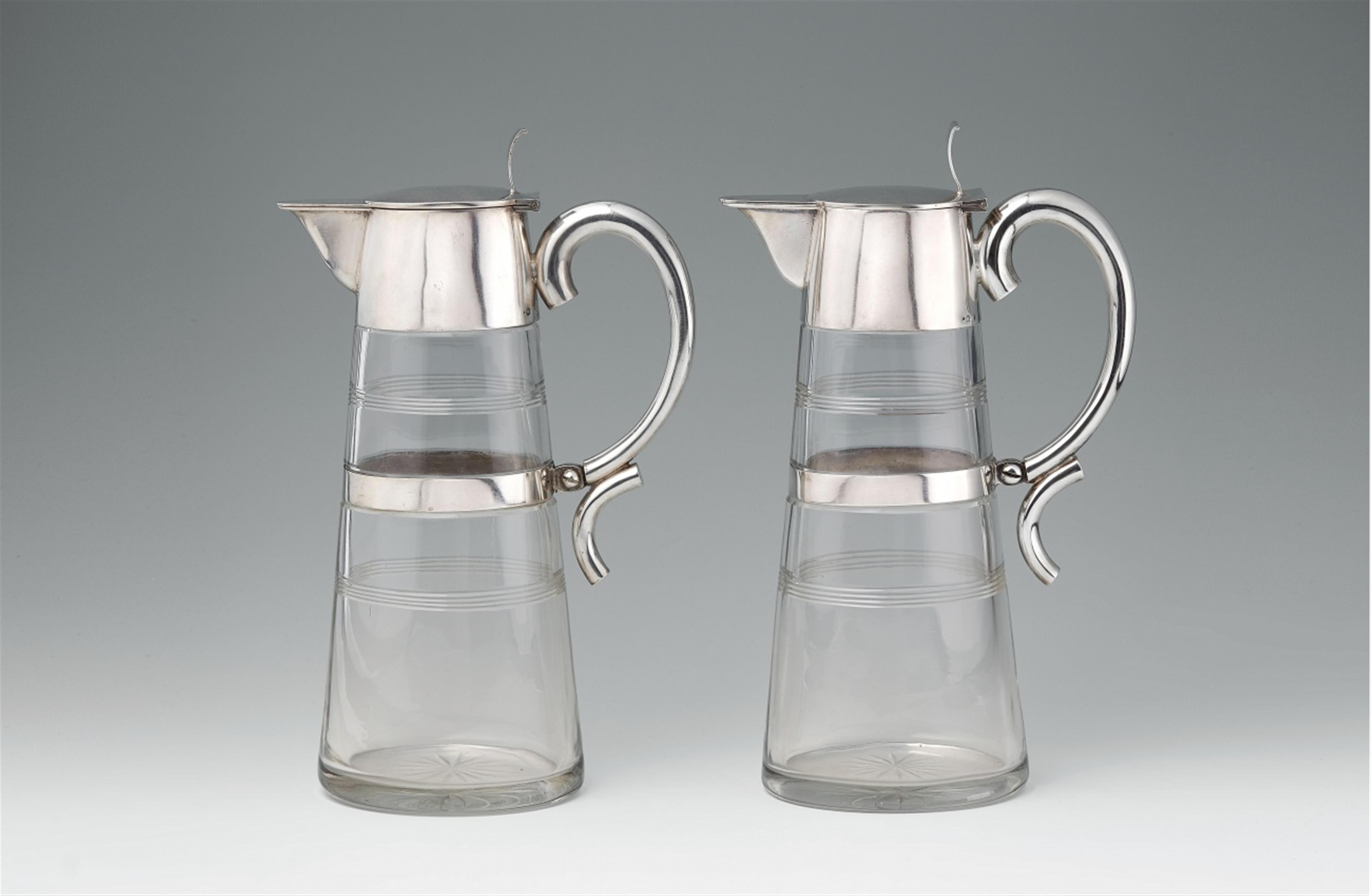 A pair of Prague silver-mounted cut glass pitchers - image-1