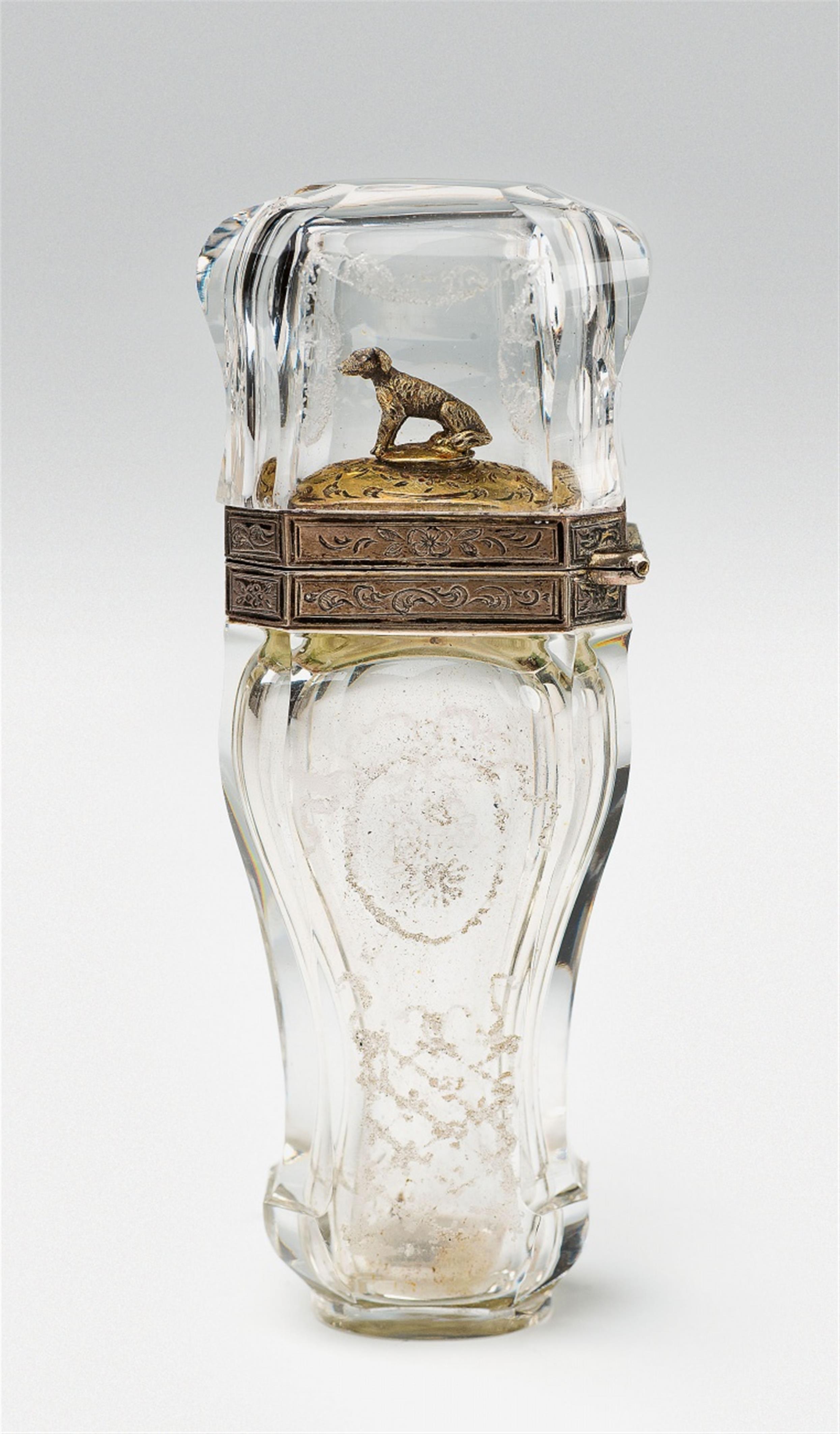 A Parisian vermeil mounted rock crystal bottle with a seated dog - image-1