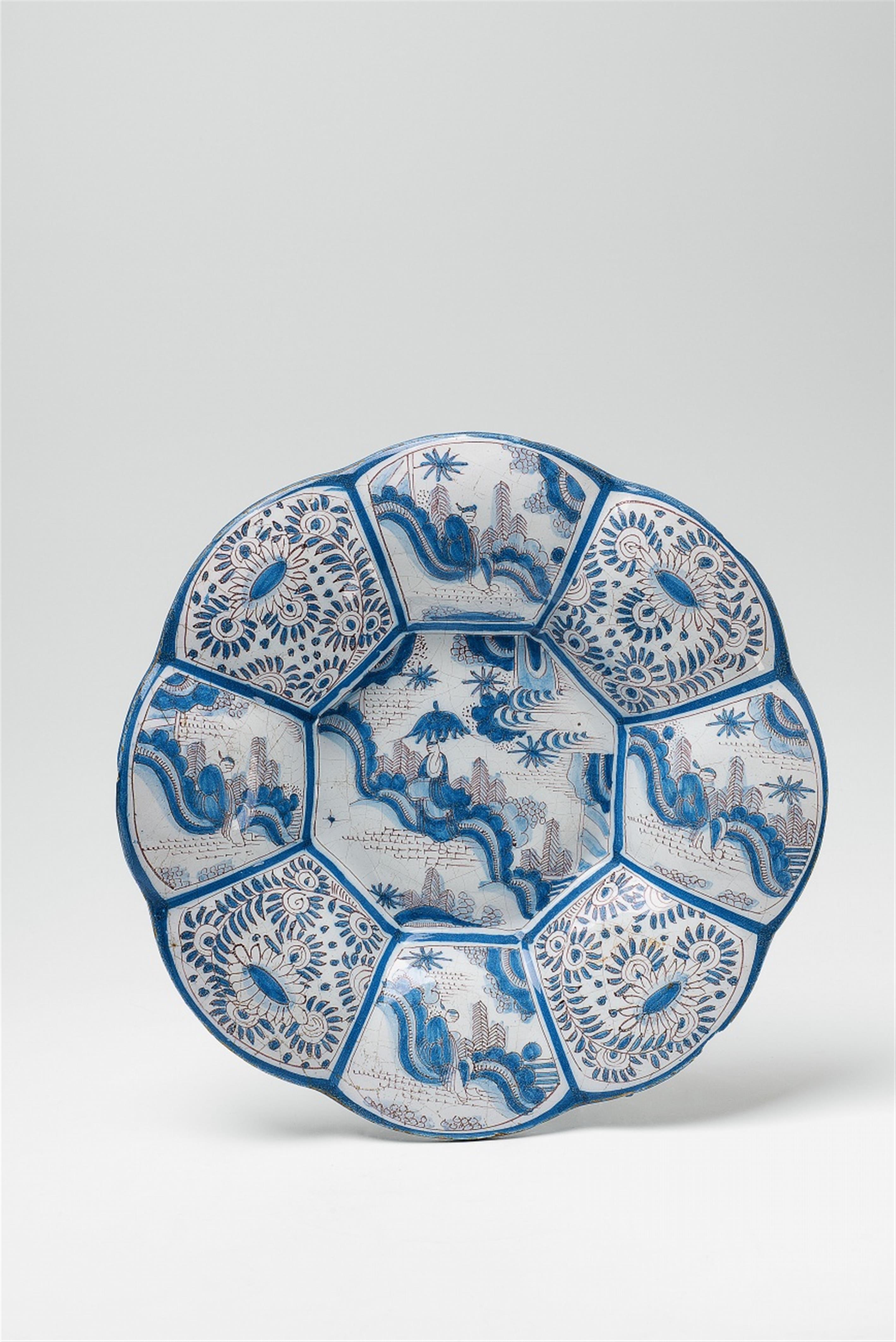 A Delft faience gadrooned charger with Chinoiserie decor - image-1