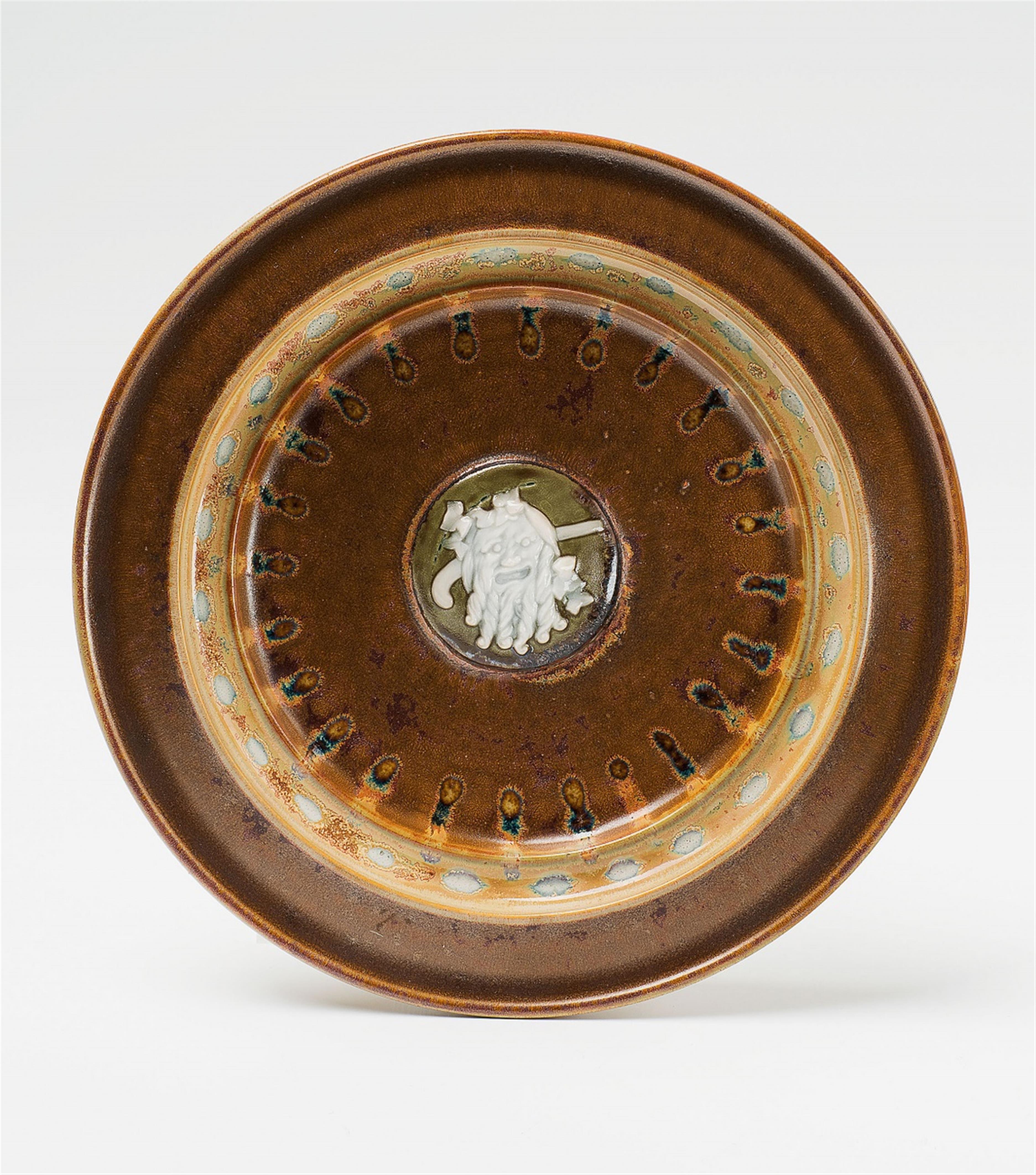A Sèvres porcelain plate with Bacchus by Taxile Doat - image-1