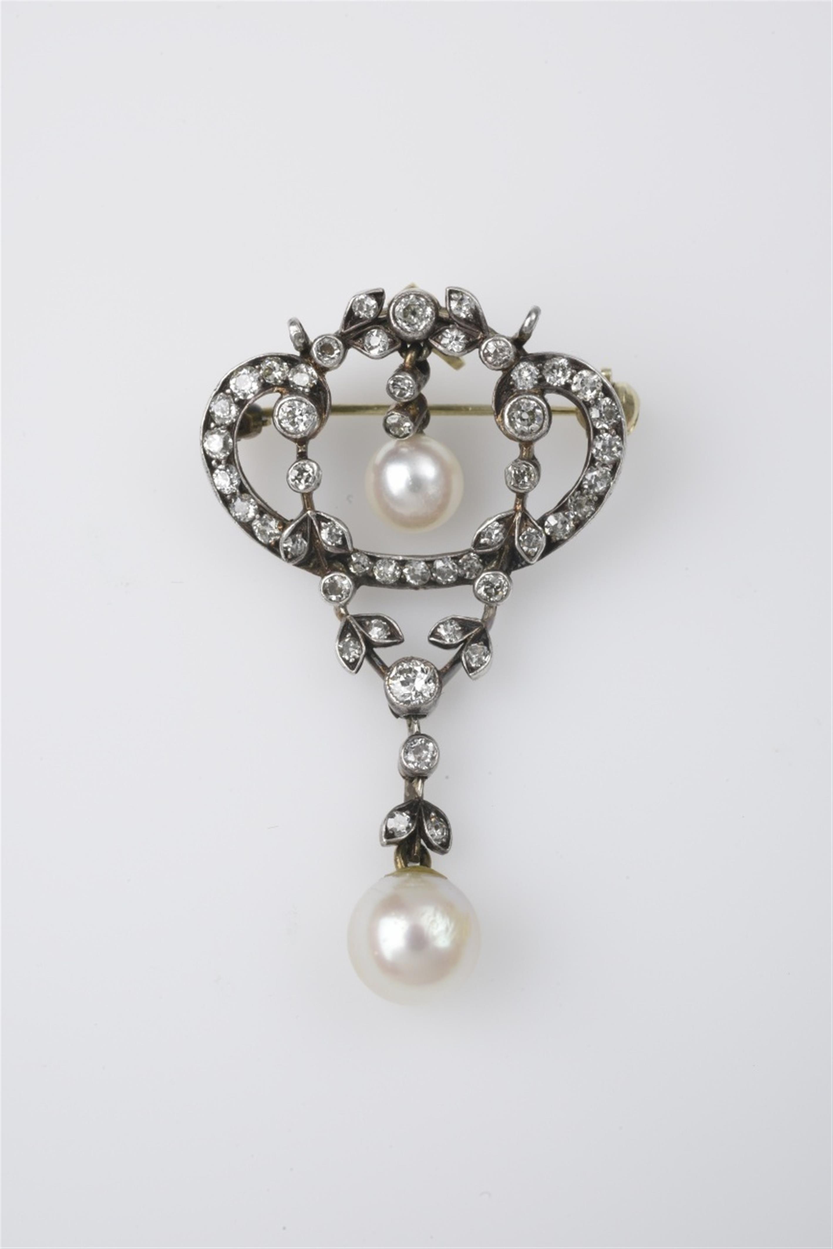 A 14k gold, silver, and diamond pendant brooch - image-1