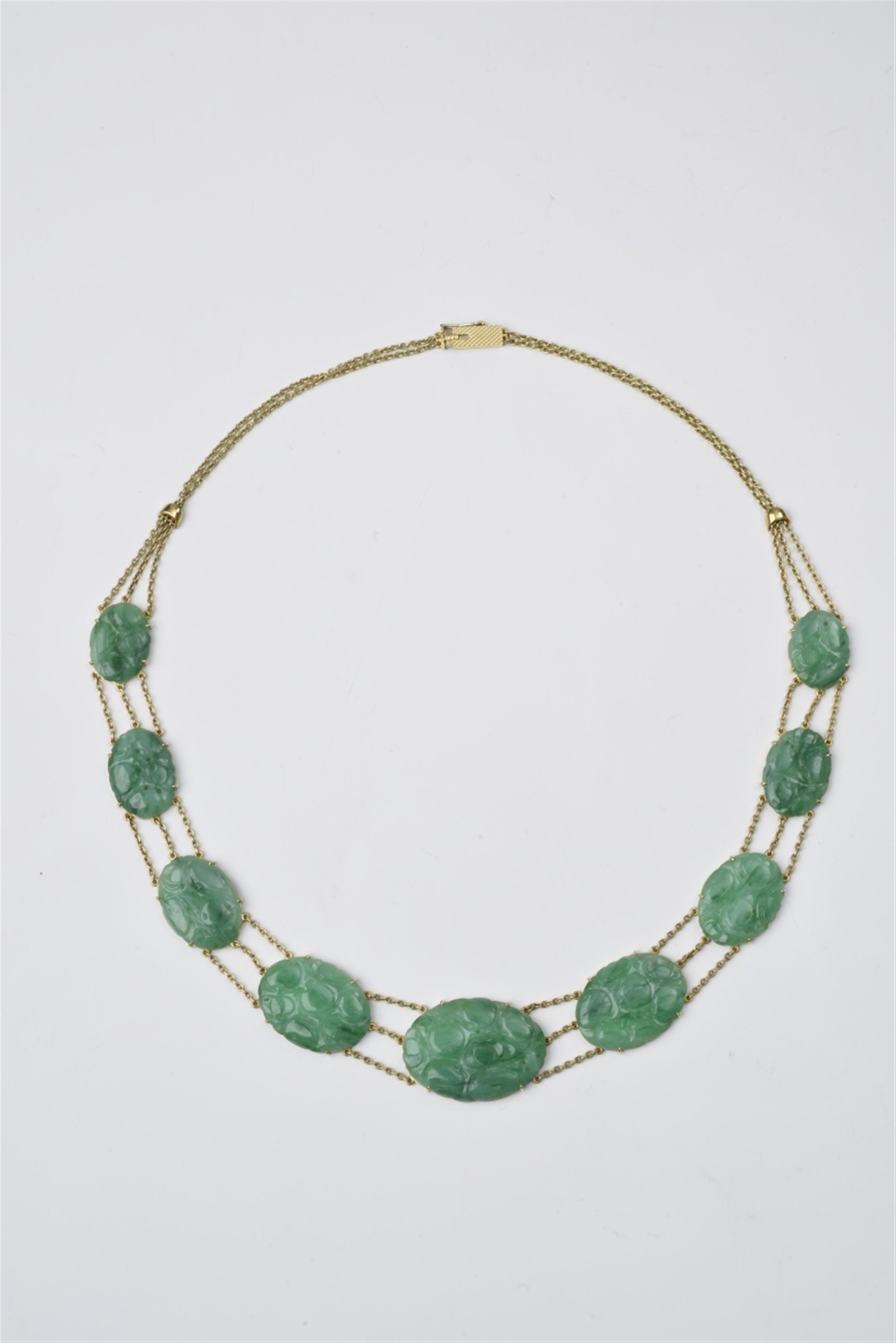 An 18k gold and carved jade collier - image-1