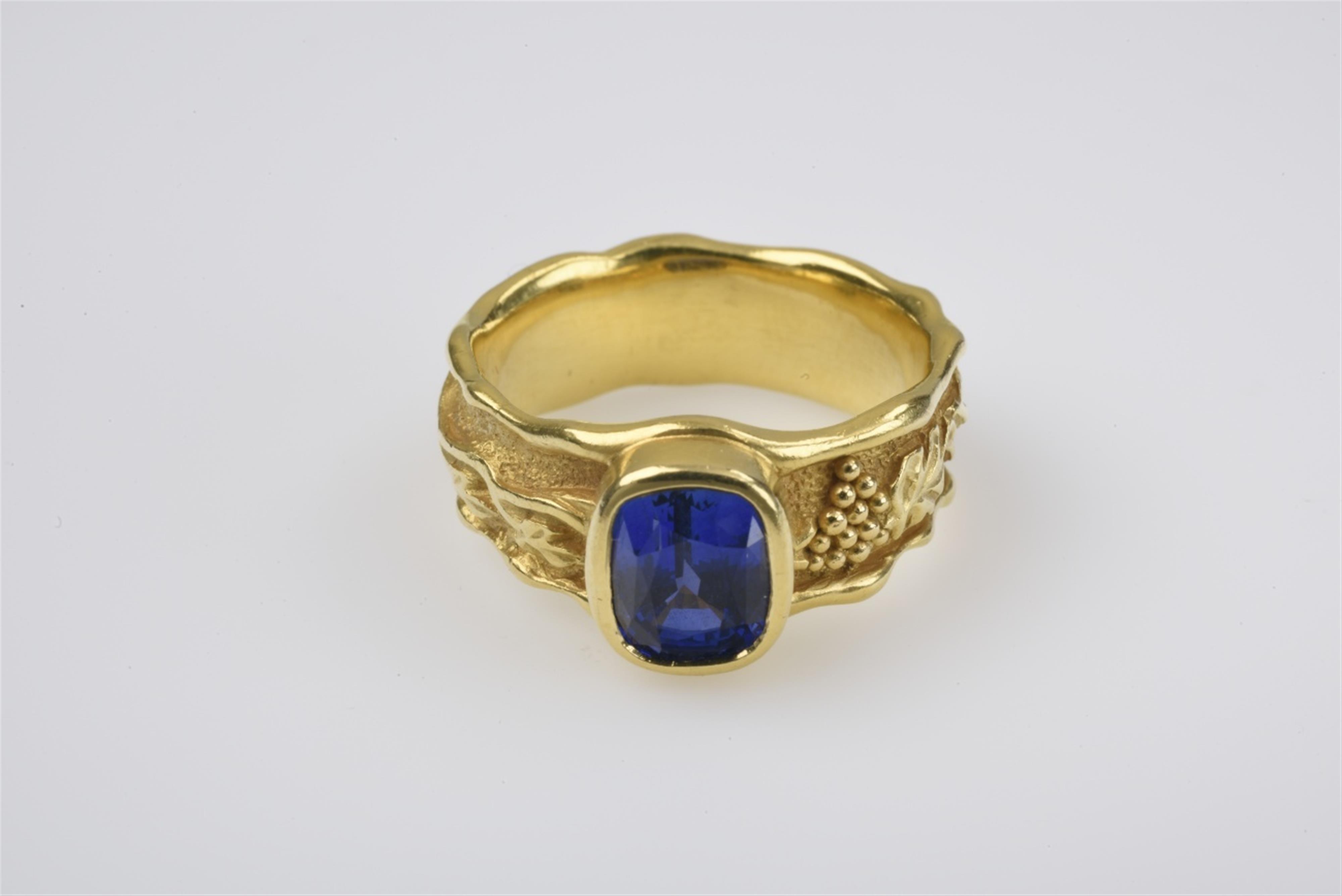 A 21k gold and sapphire gentlemans ring - image-1