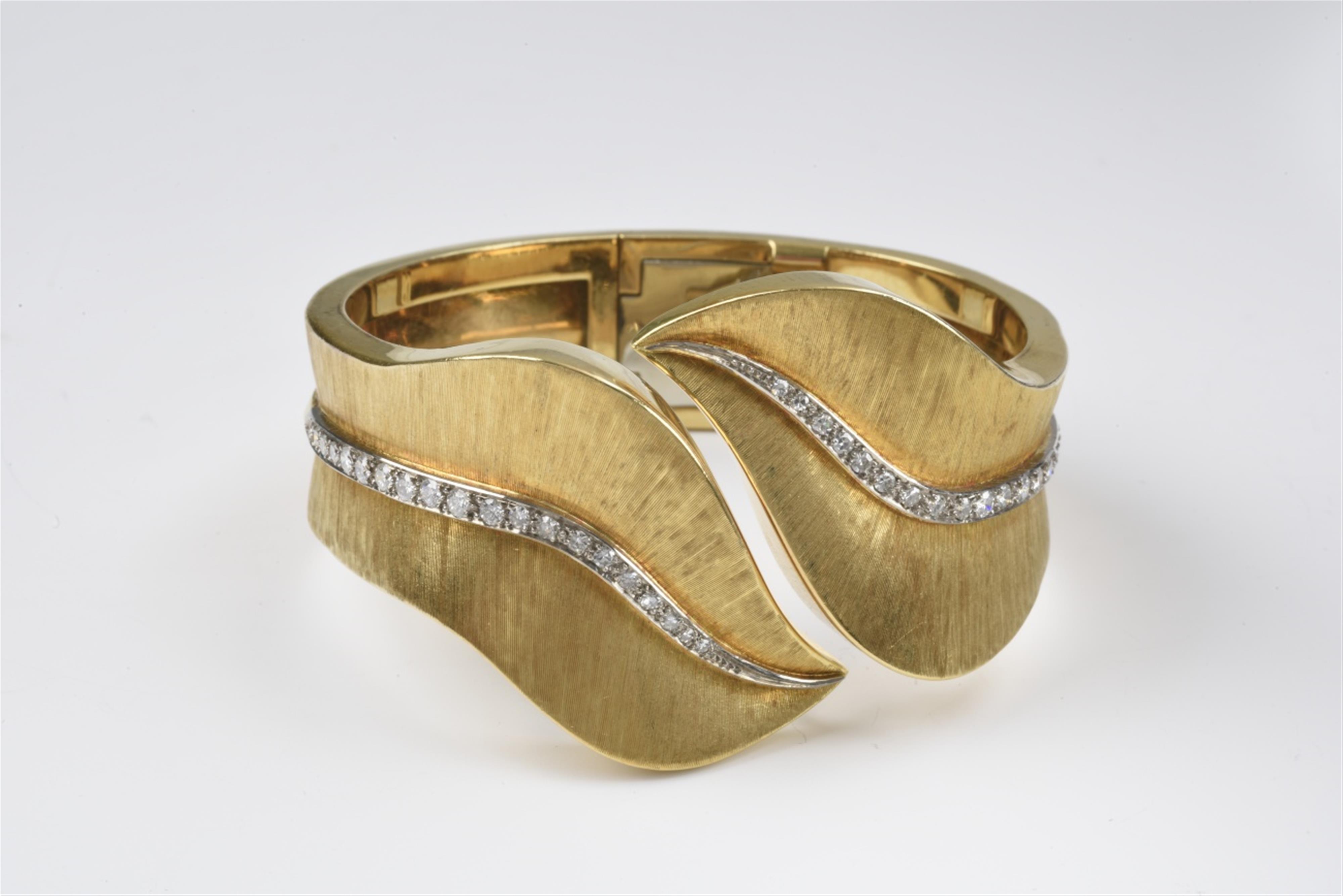 An 18k gold and diamond cuff bangle - image-1
