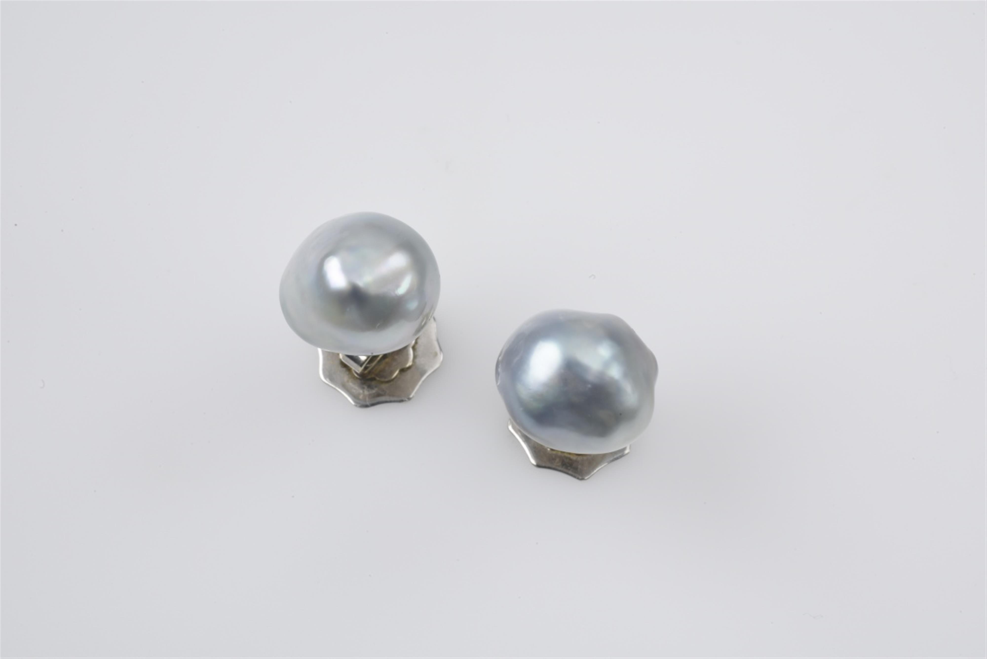 A pair of 14k white gold and Tahiti pearl stud earrings - image-1