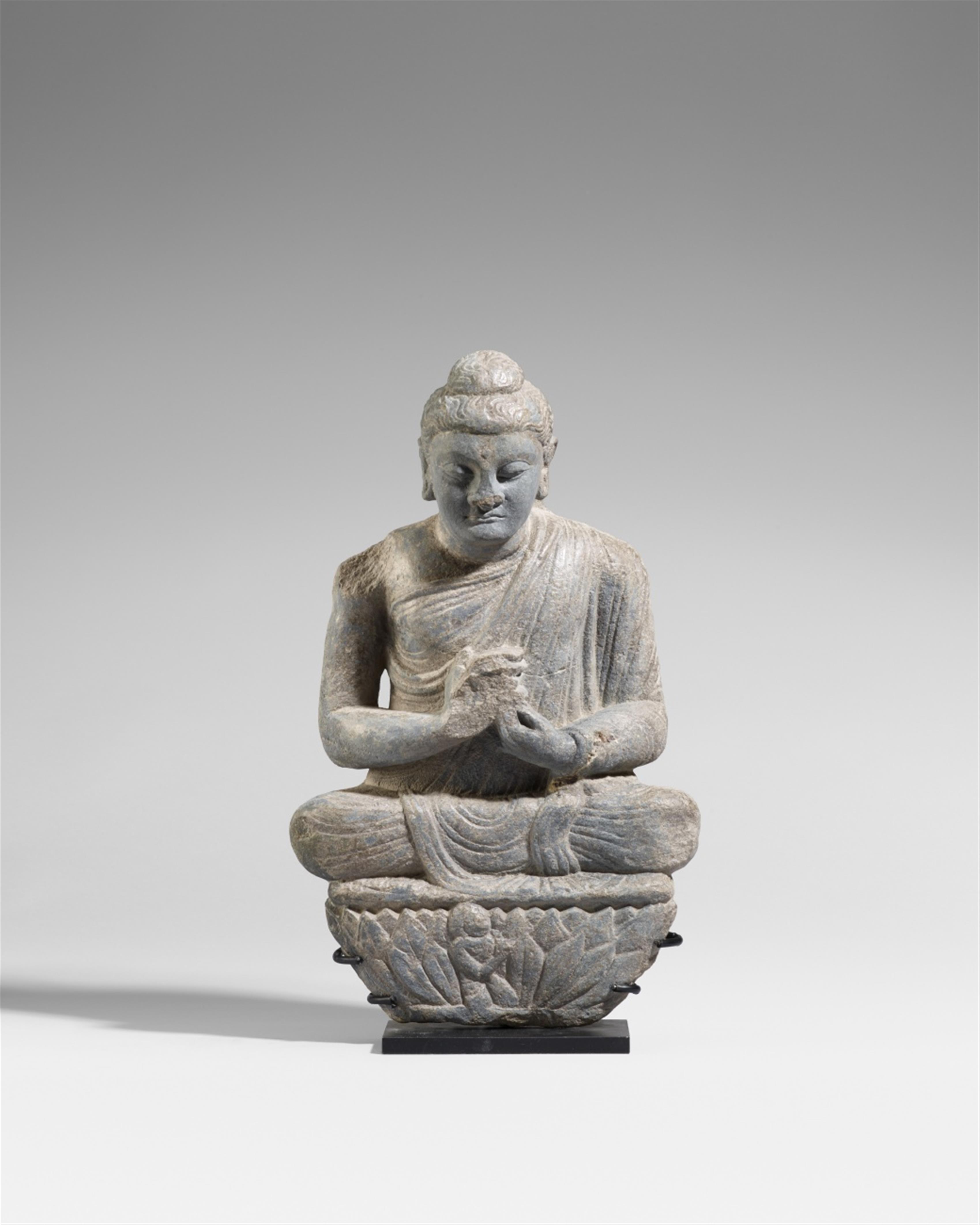 A Gandhara grey schist figure of a Buddha. 3rd century - image-1