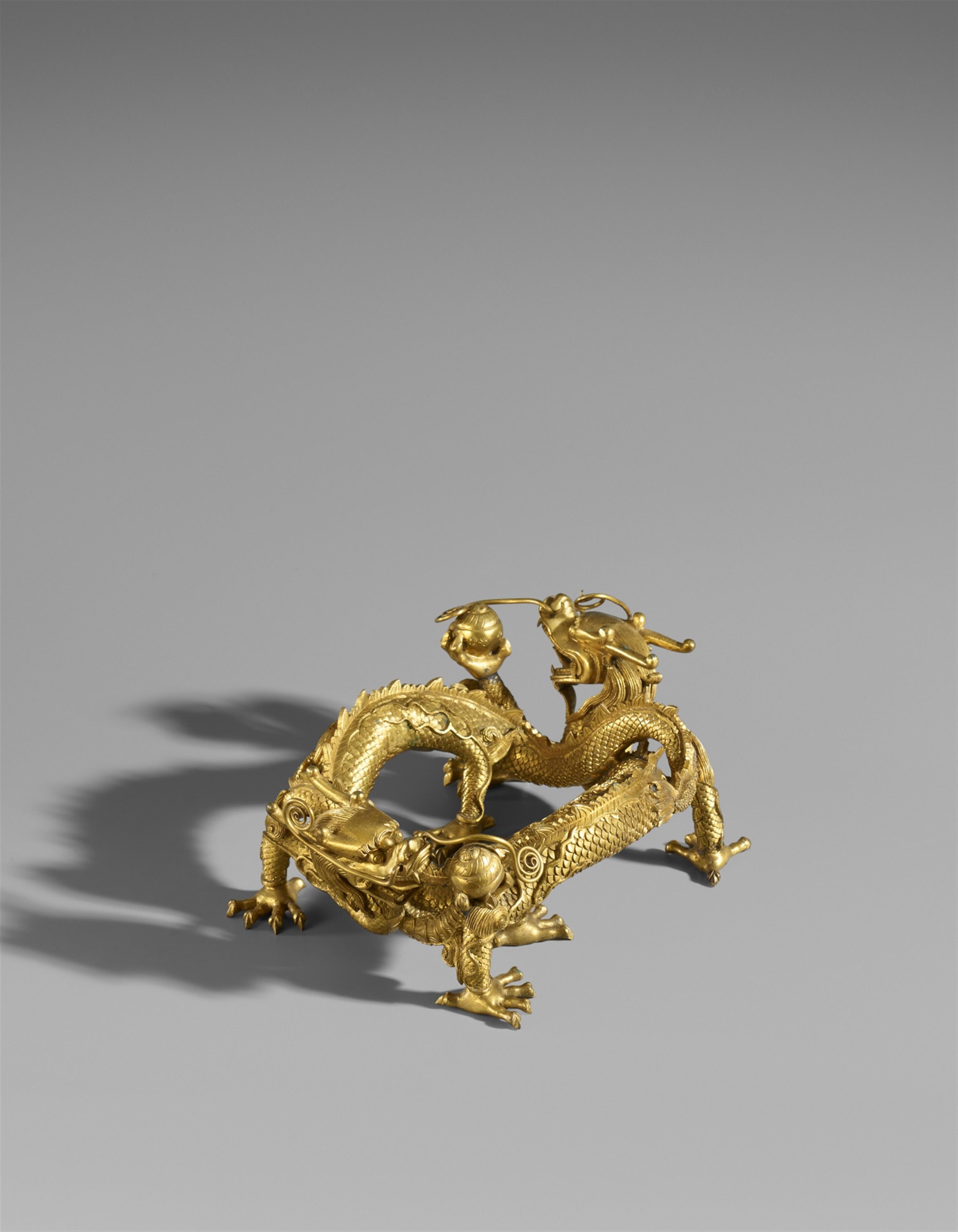 A fire-gilt bronze stand for a crystal ball. 17th/18th century - image-1