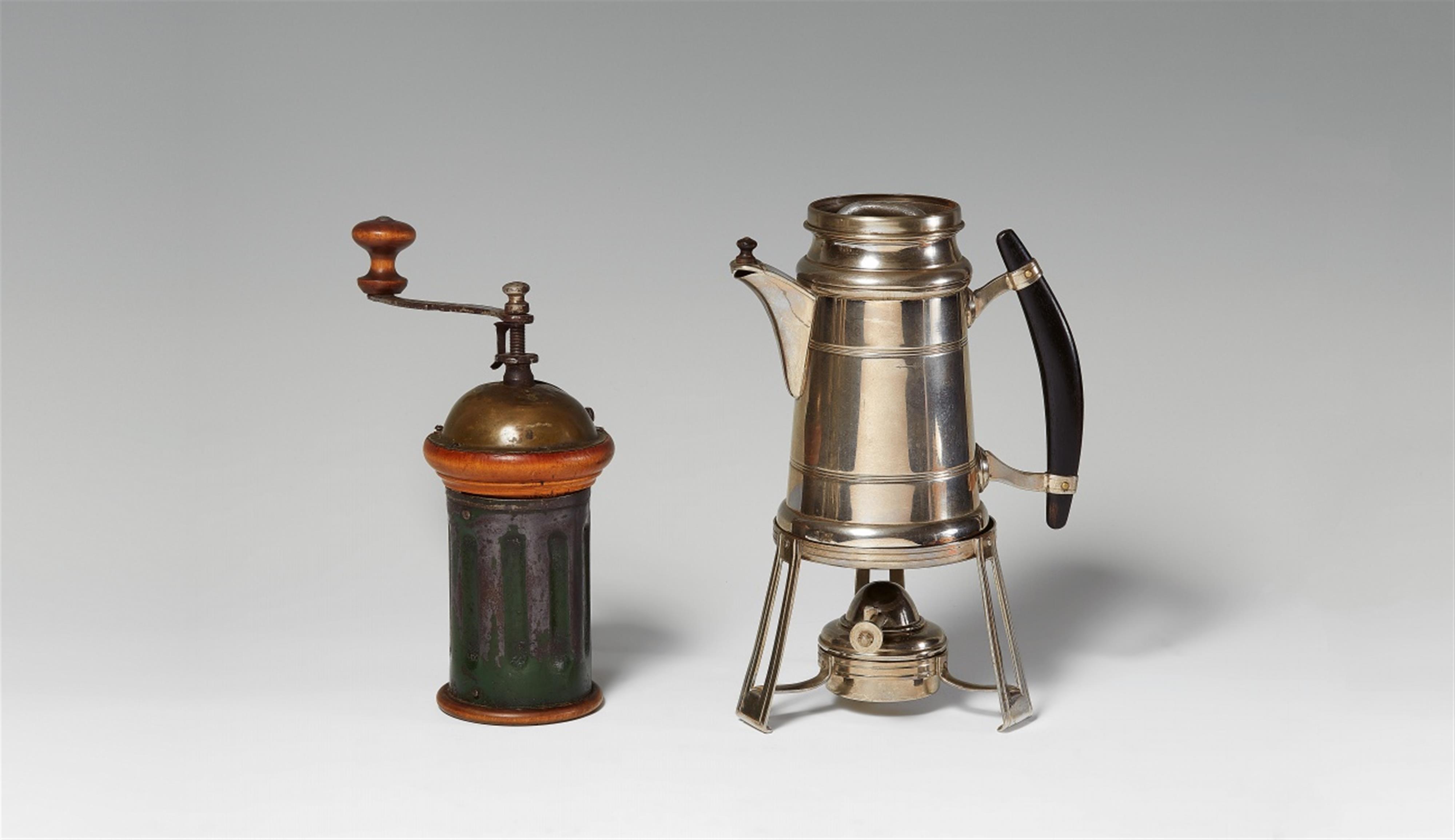 A chrome-plated coffee maker on a spirit stove - image-1