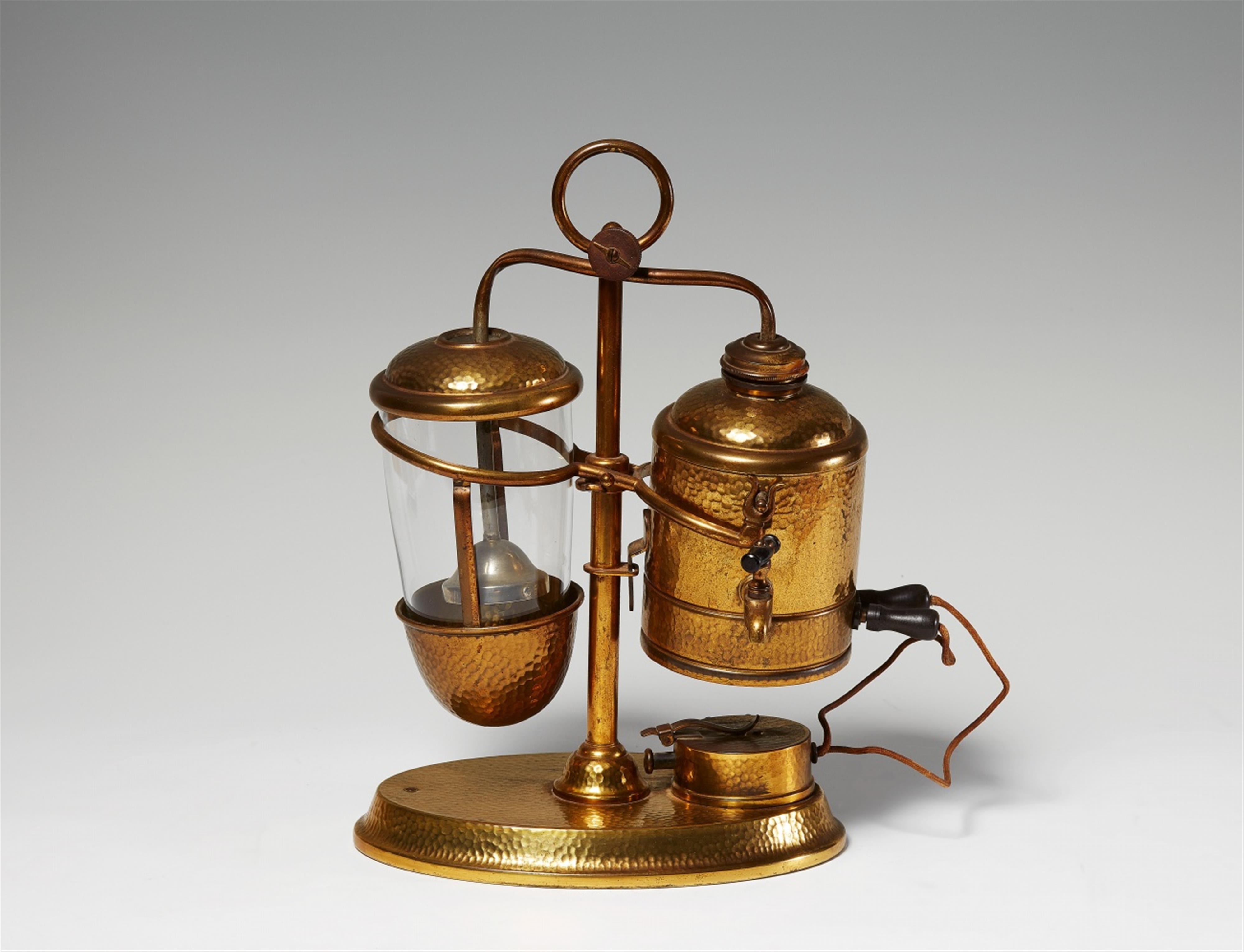 A gilt metal tilting electric coffee maker - image-1