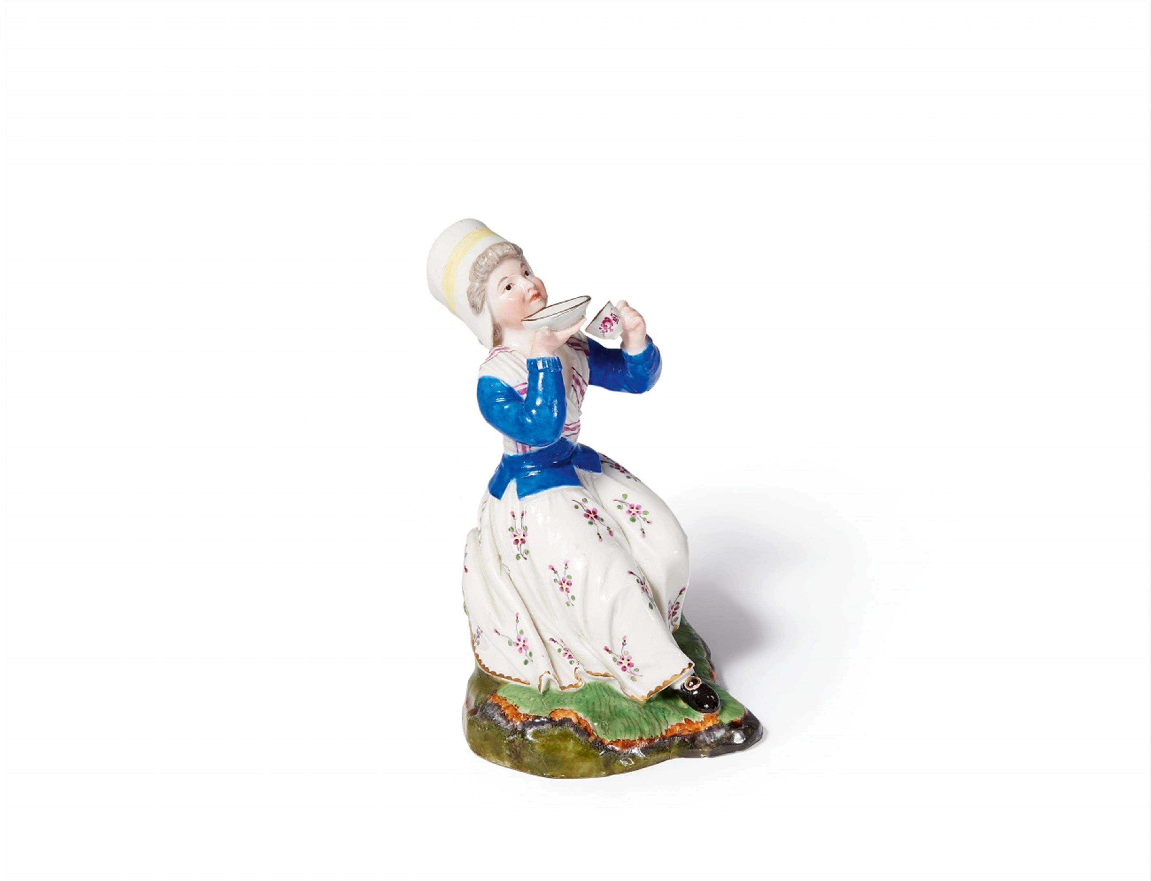 A small Höchst porcelain figure of a lady drinking coffee - image-1