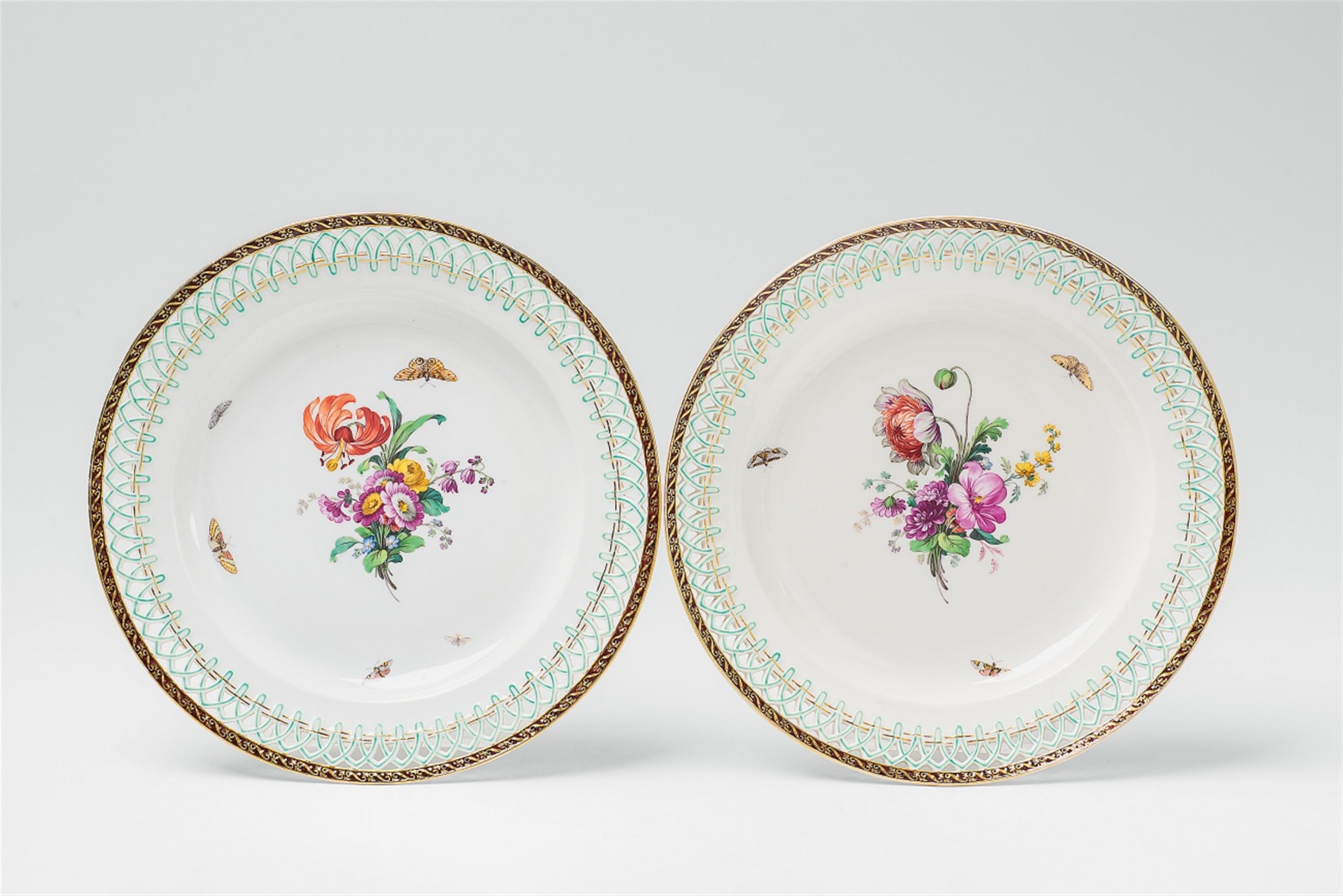 A pair of Berlin KPM porcelain dessert plates with naturalistic flowers - image-1