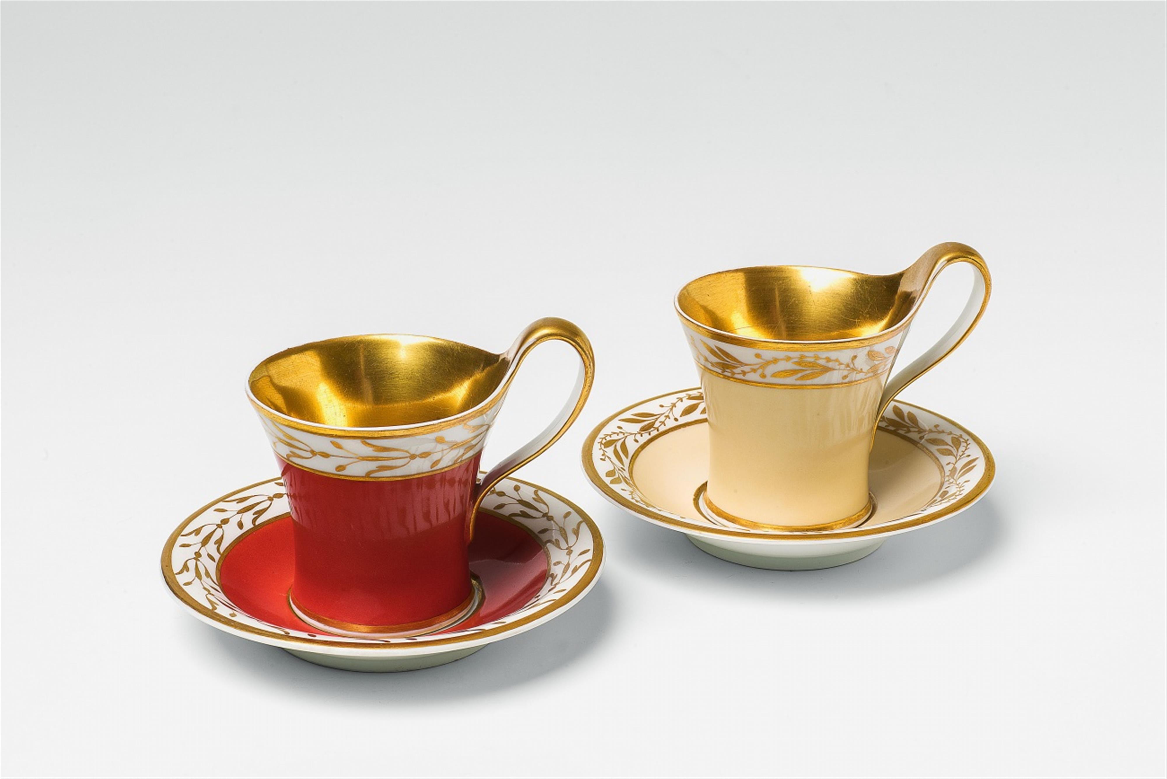 Two Berlin KPM Neoclassical porcelain cups with coloured ground - image-1