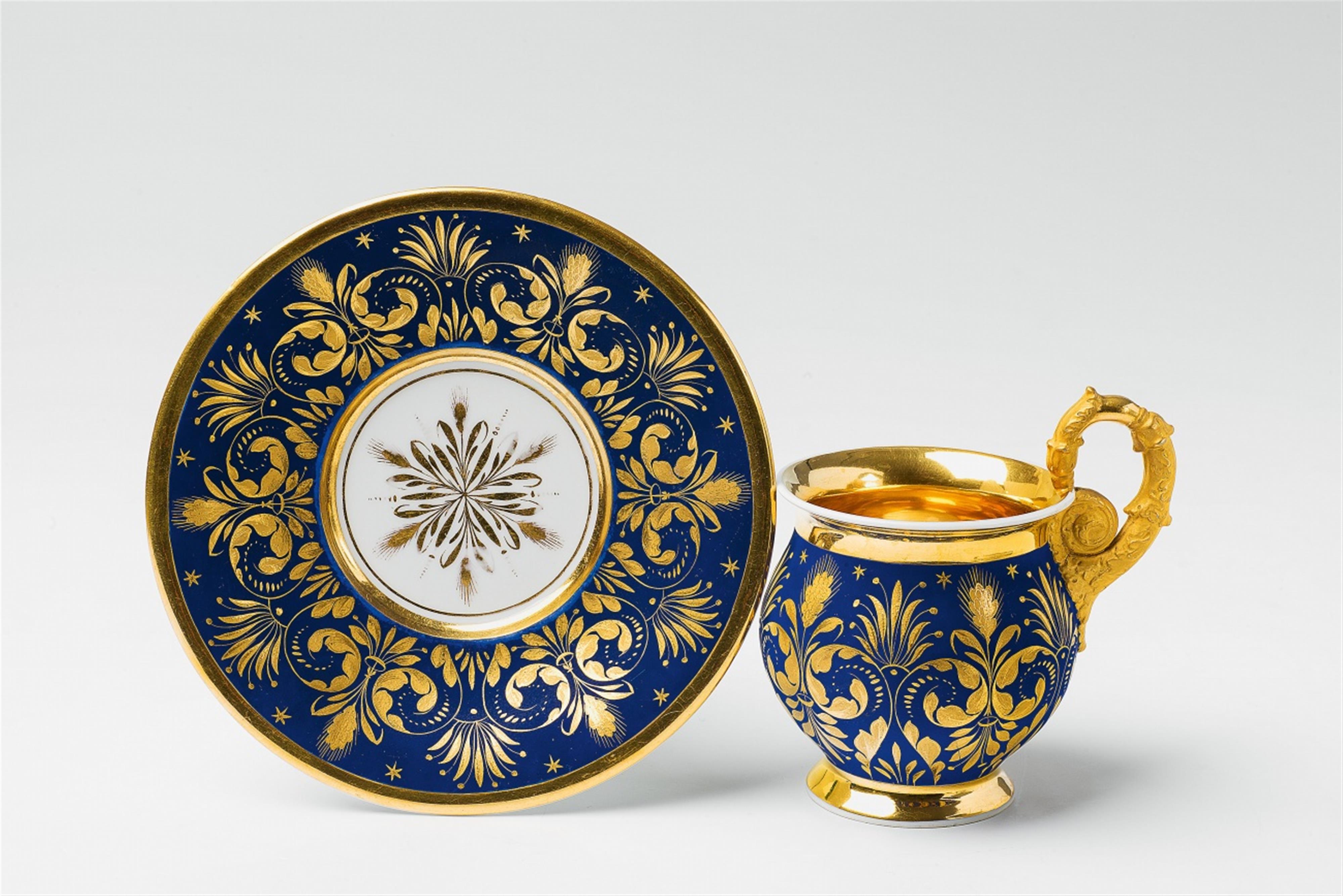 A rare Berlin KPM porcelain cup and saucer with royal blue ground - image-1