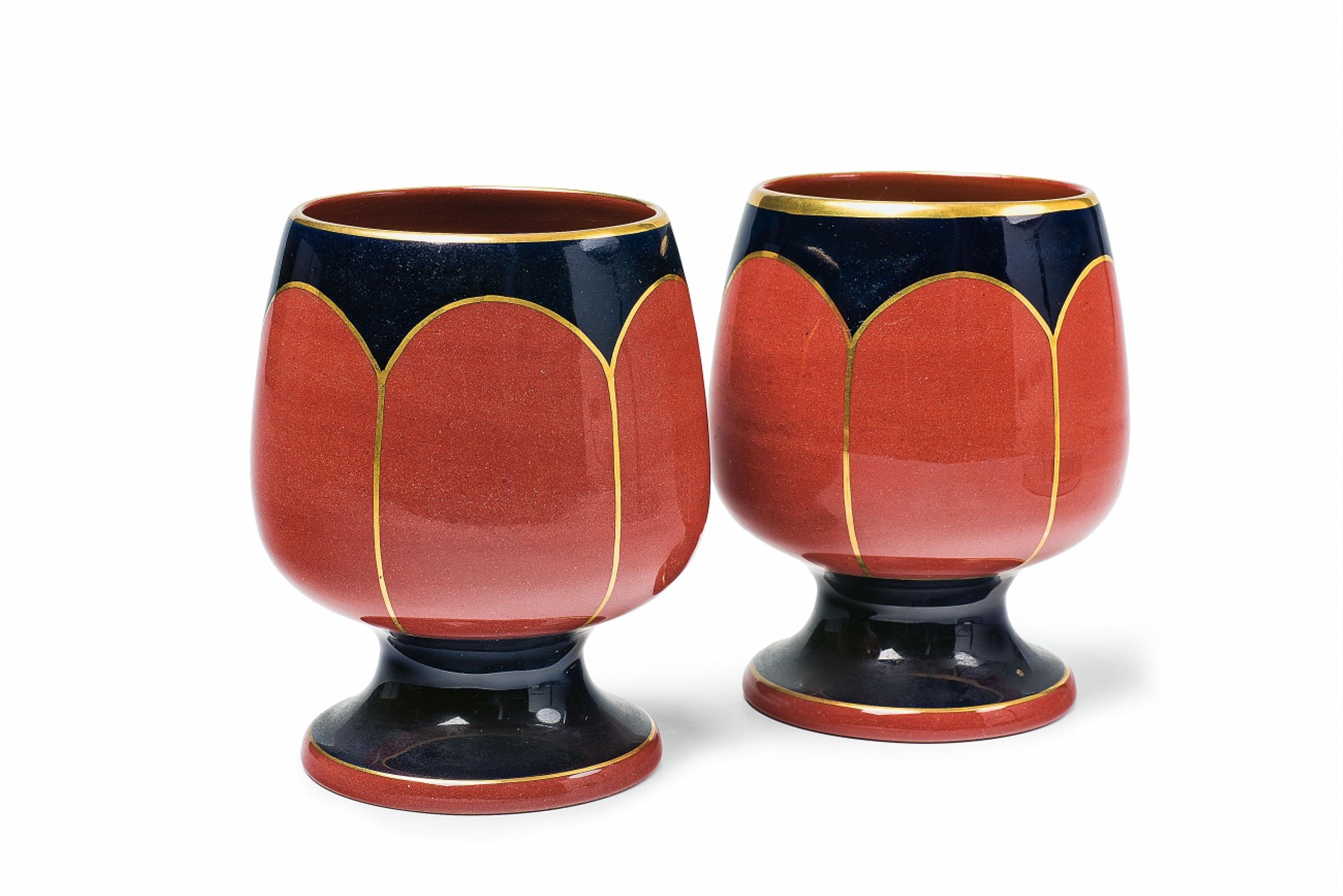 A pair of Cadinen maiolica beakers - image-1