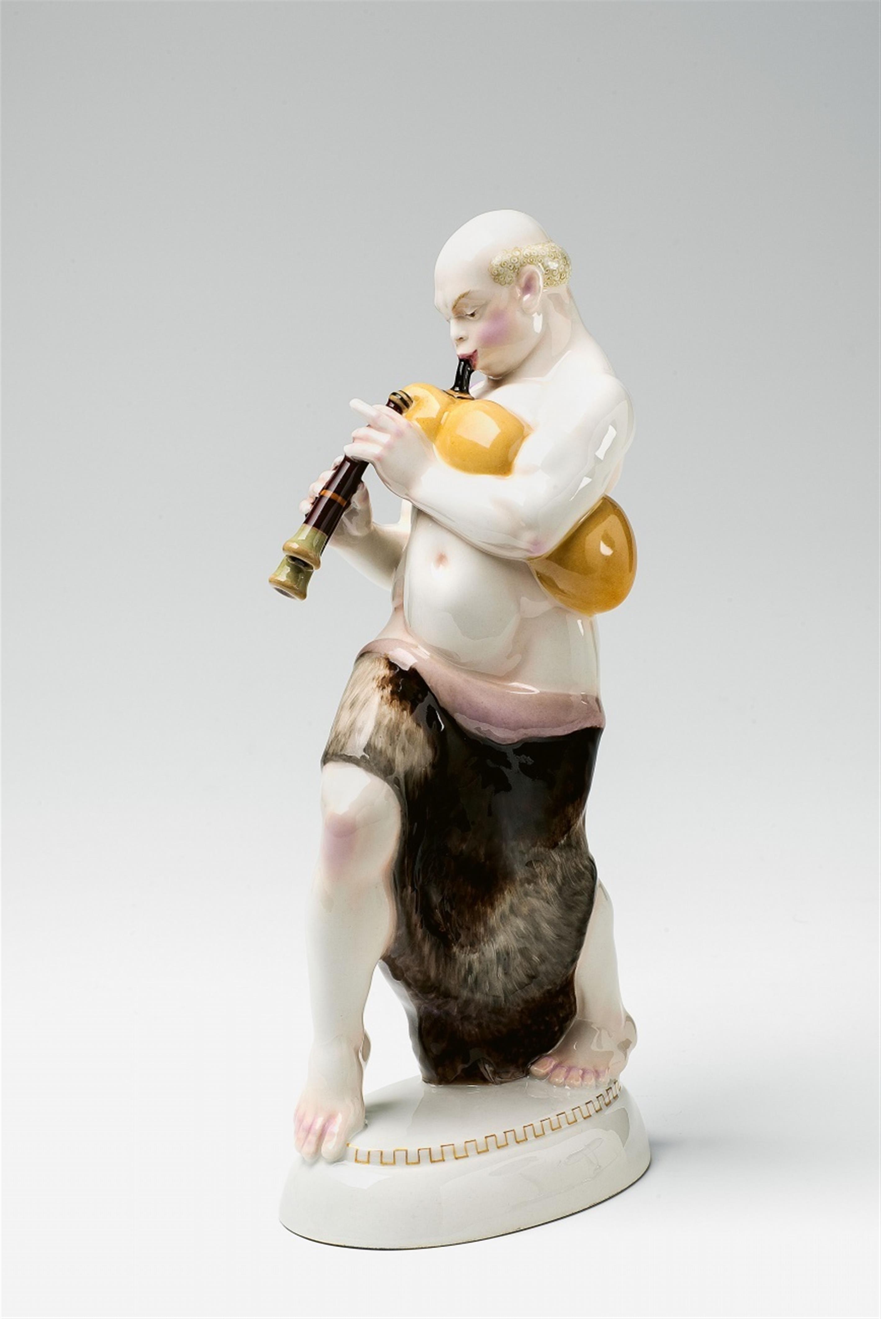 A Berlin KPM porcelain figure of an Arabian playing bagpipes - image-1