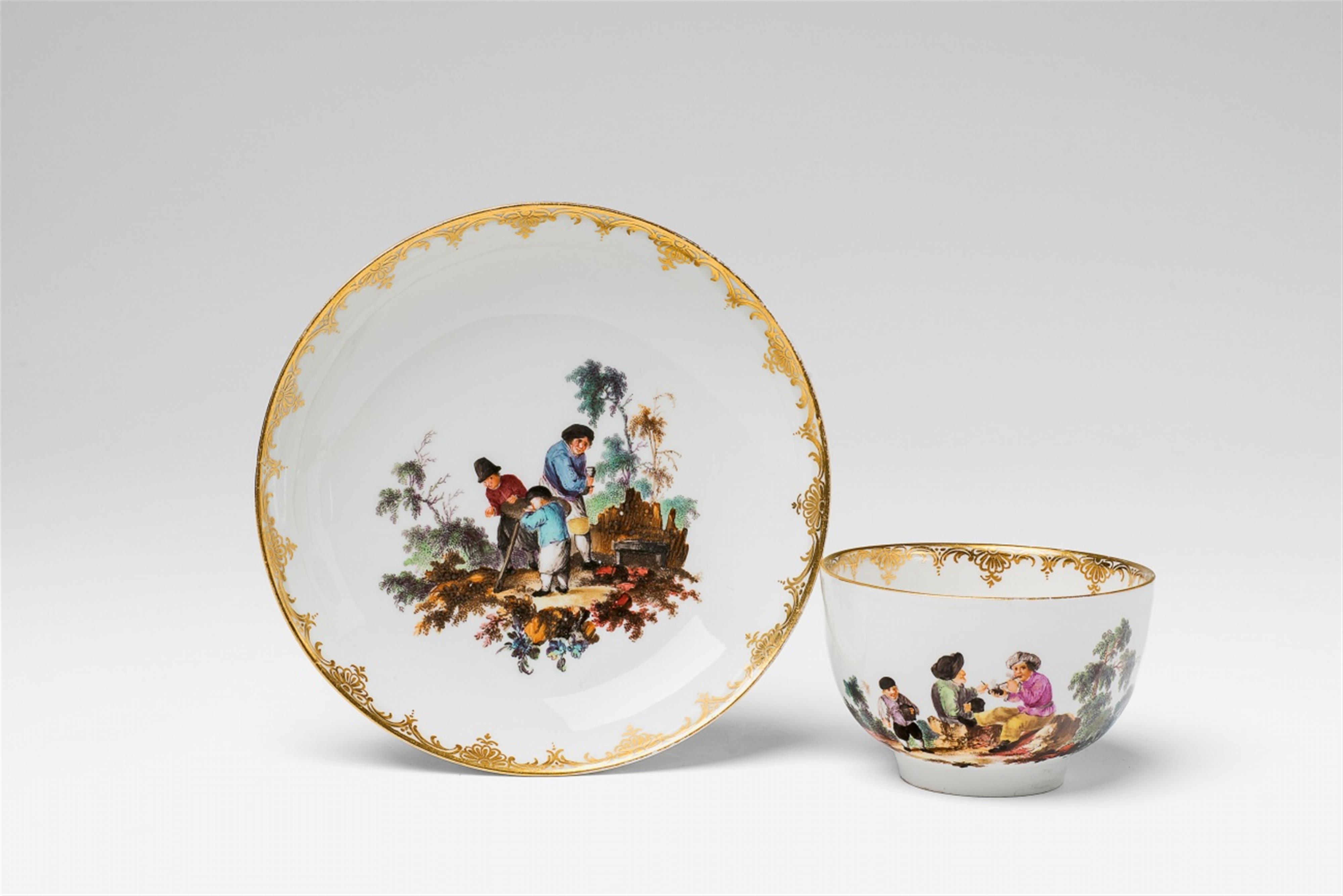 A Berlin KPM porcelain teacup with genre scenes - image-1
