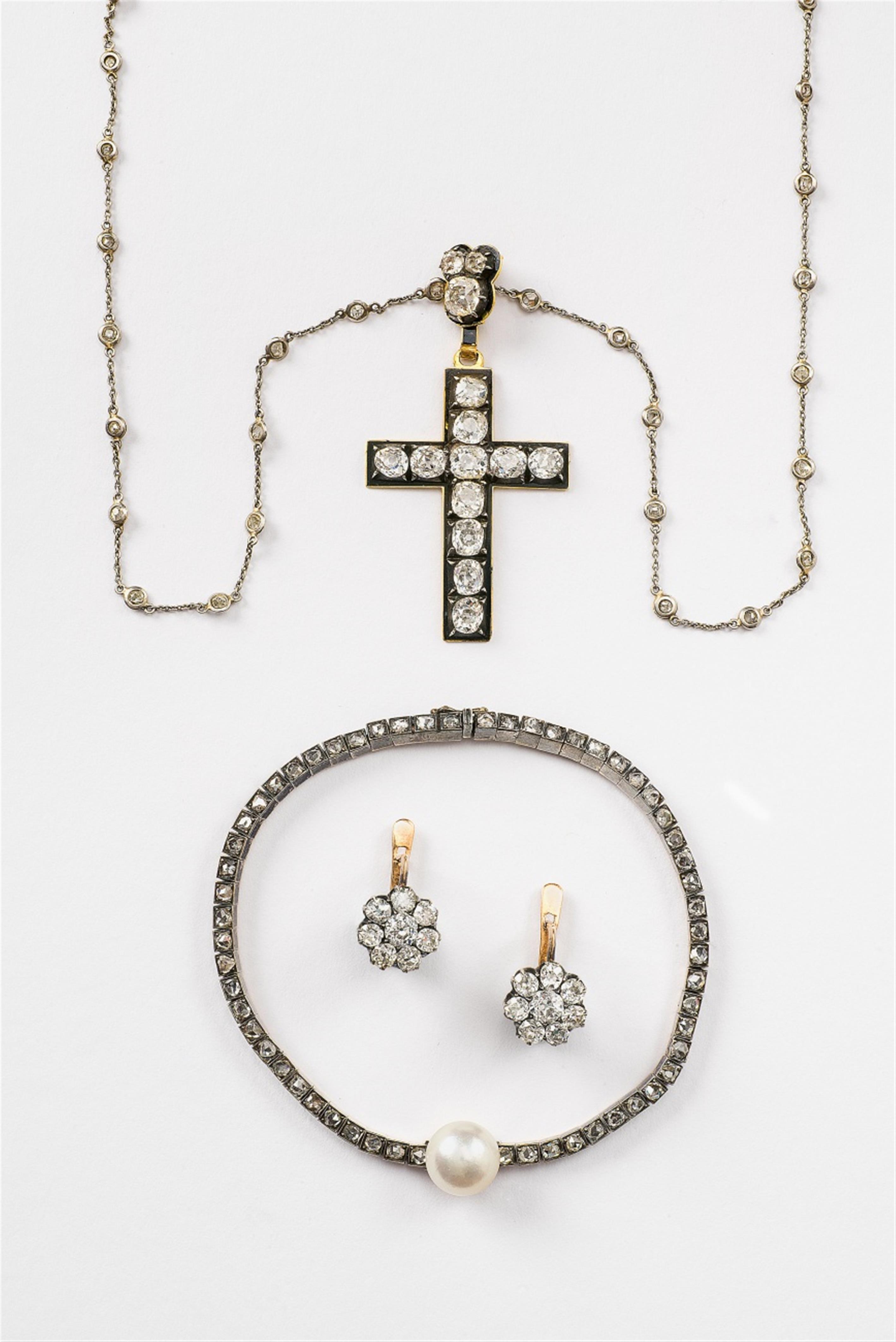 An 18k gold and diamond cross pendant - image-1