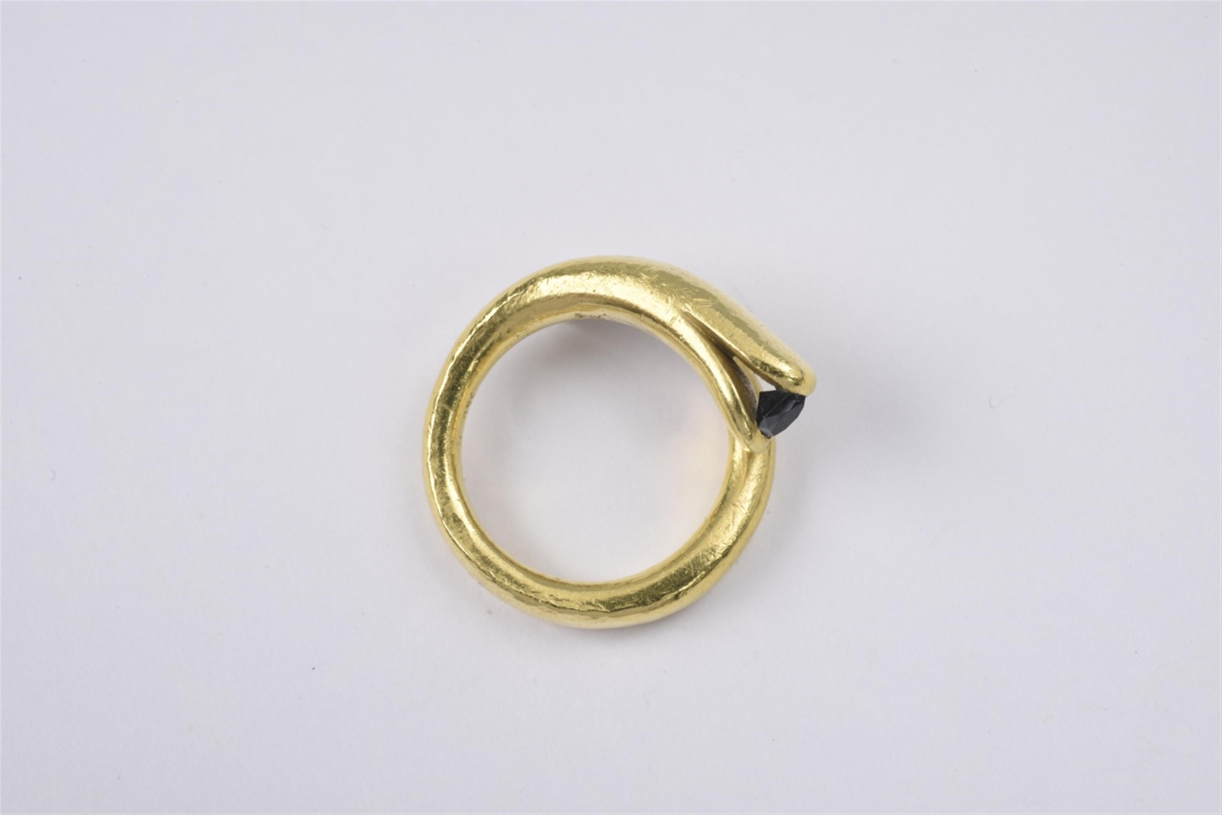 An 18k gold and diamond snake ring - image-1