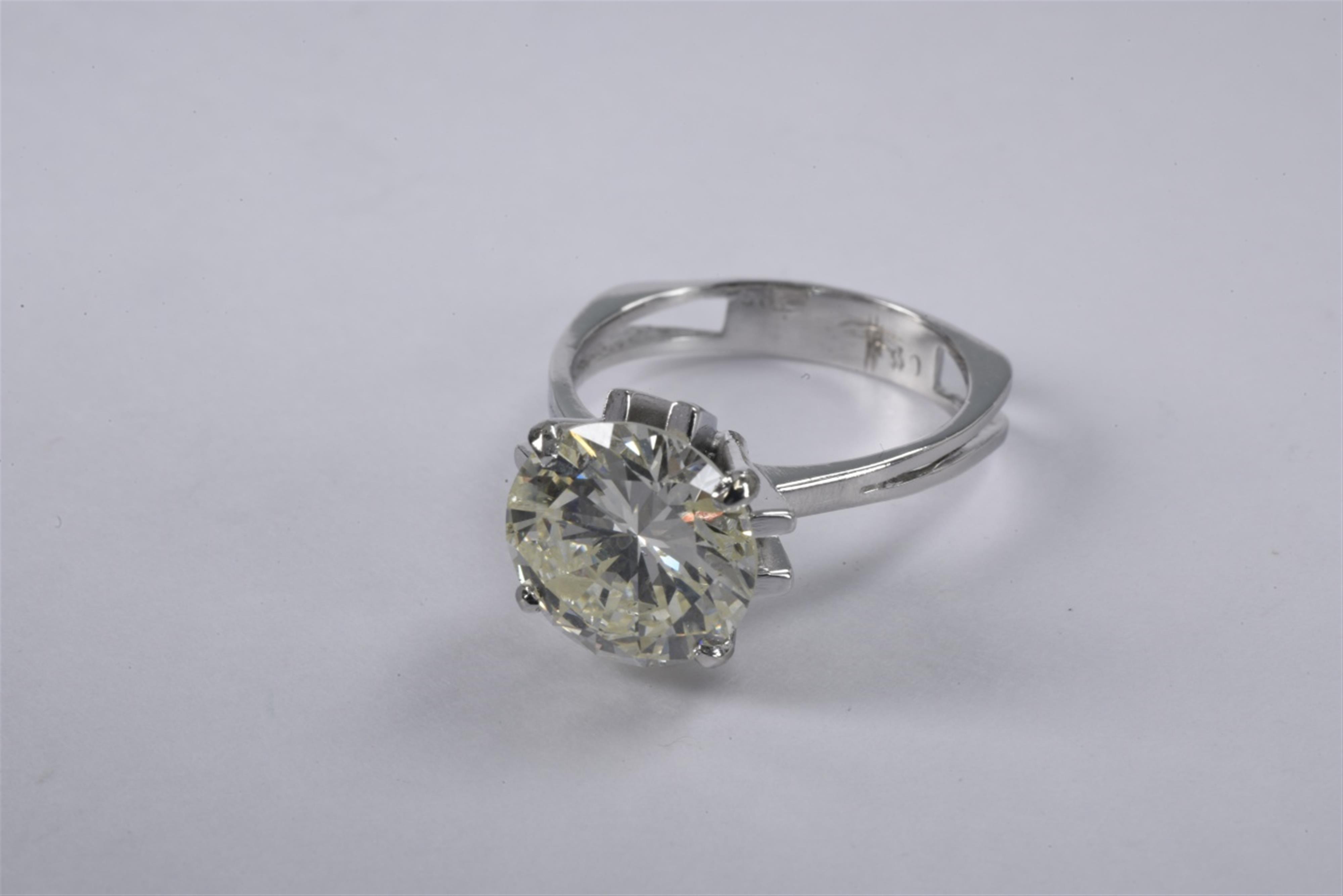 A 14k white gold diamond solitaire ring - image-1