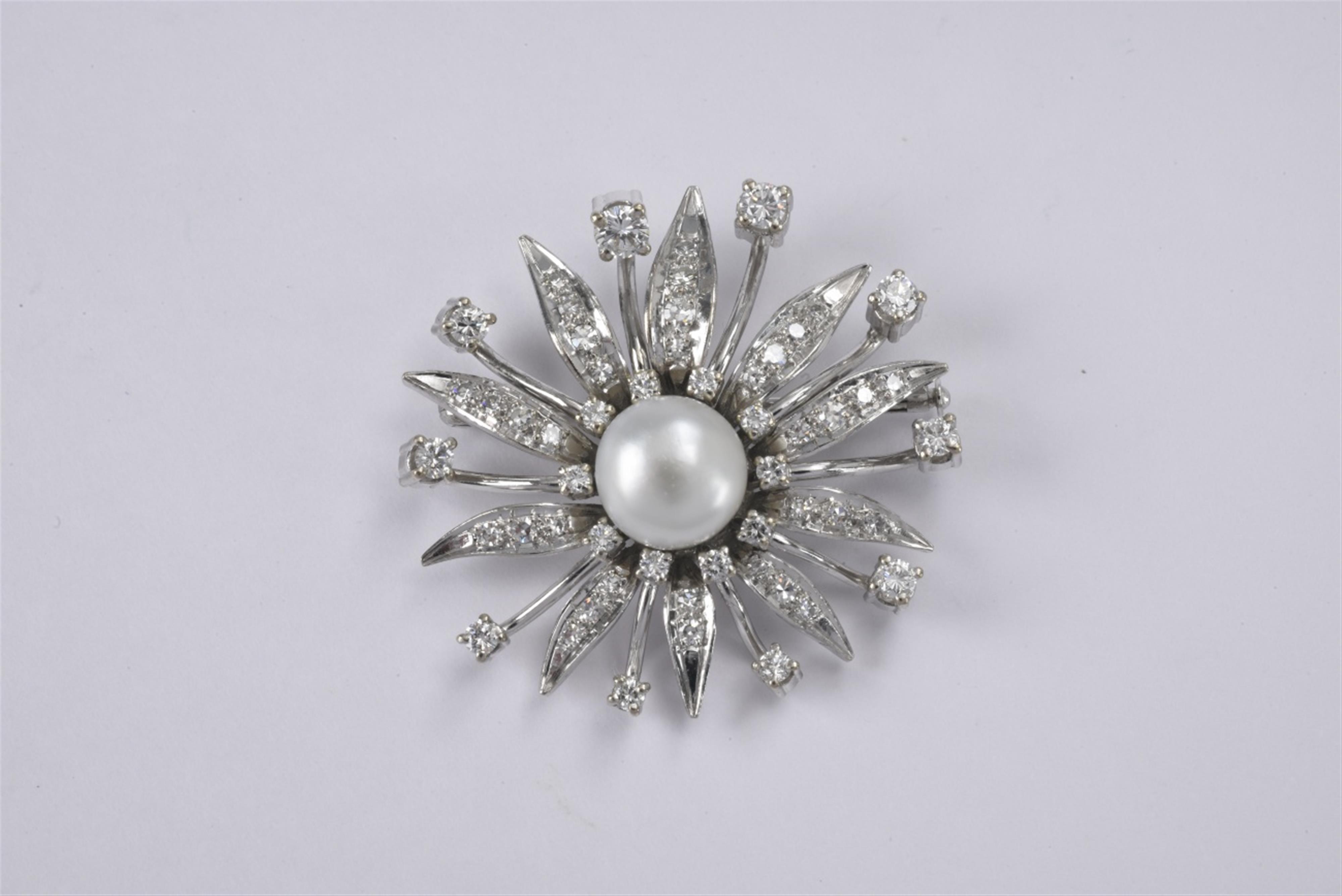 A 14k white gold and diamond brooch - image-1