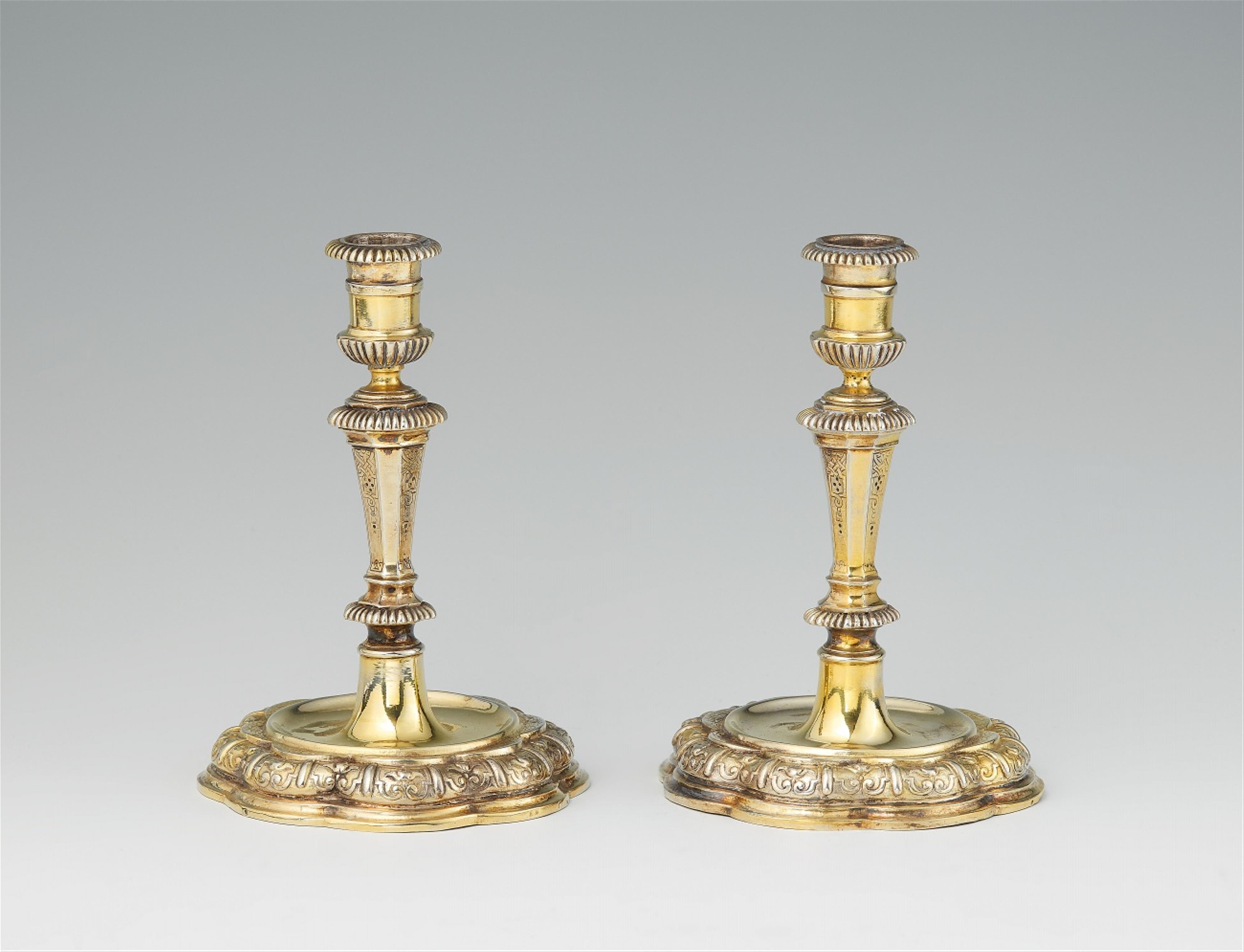 A pair of Augsburg silver gilt candlesticks - image-1