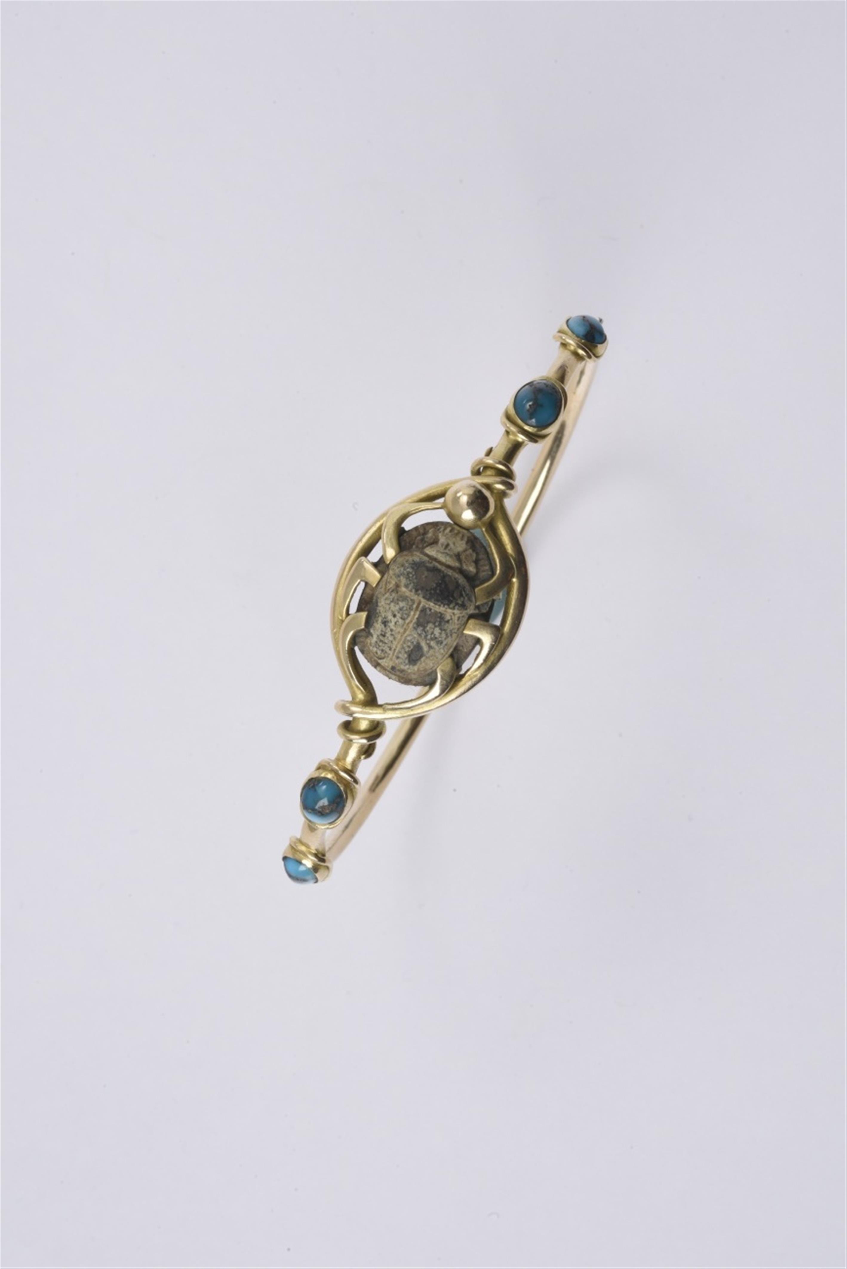 A 14k gold bracelet with an Egyptian scarab - image-1