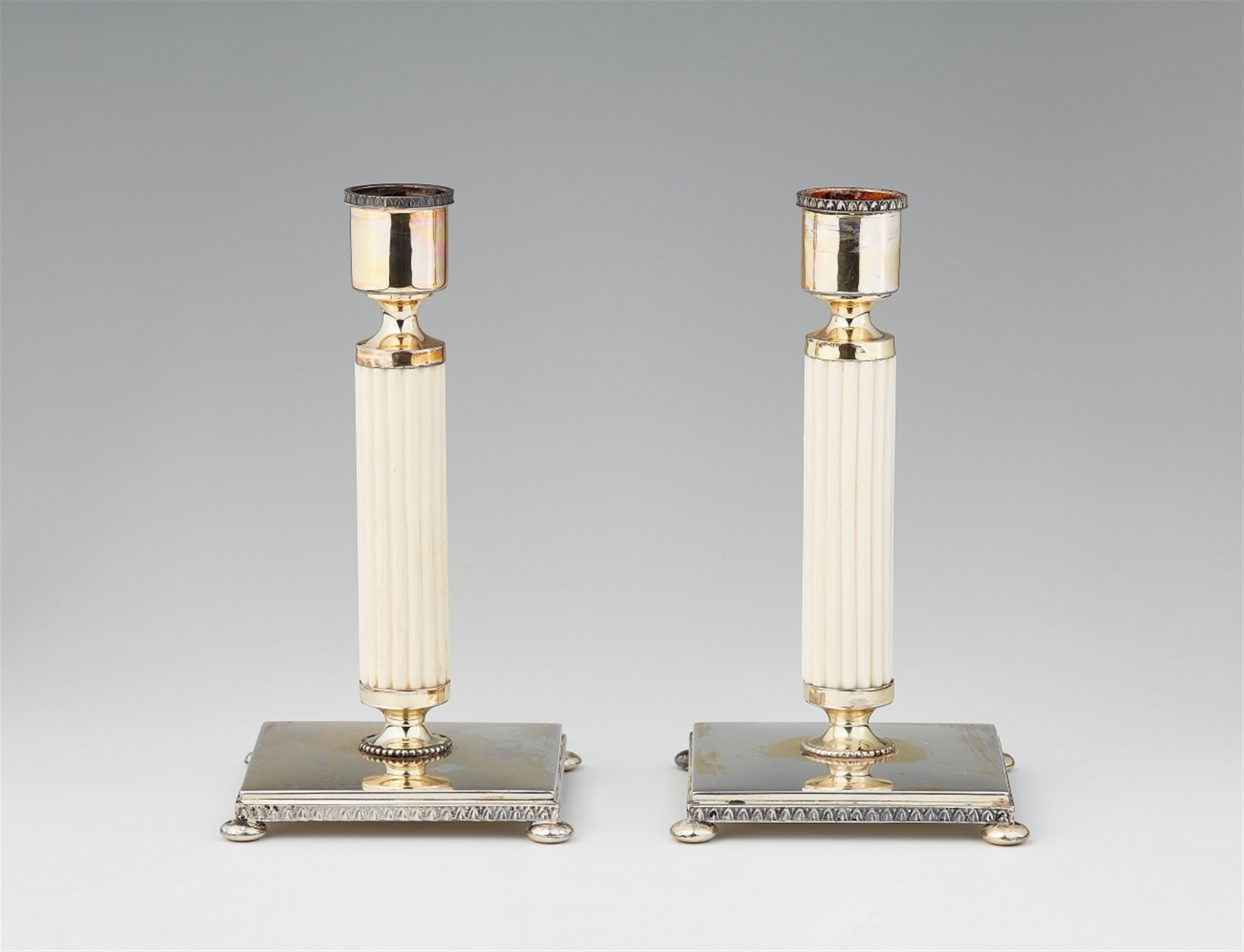 A pair of Art Deco silver and ivory candlesticks - image-1