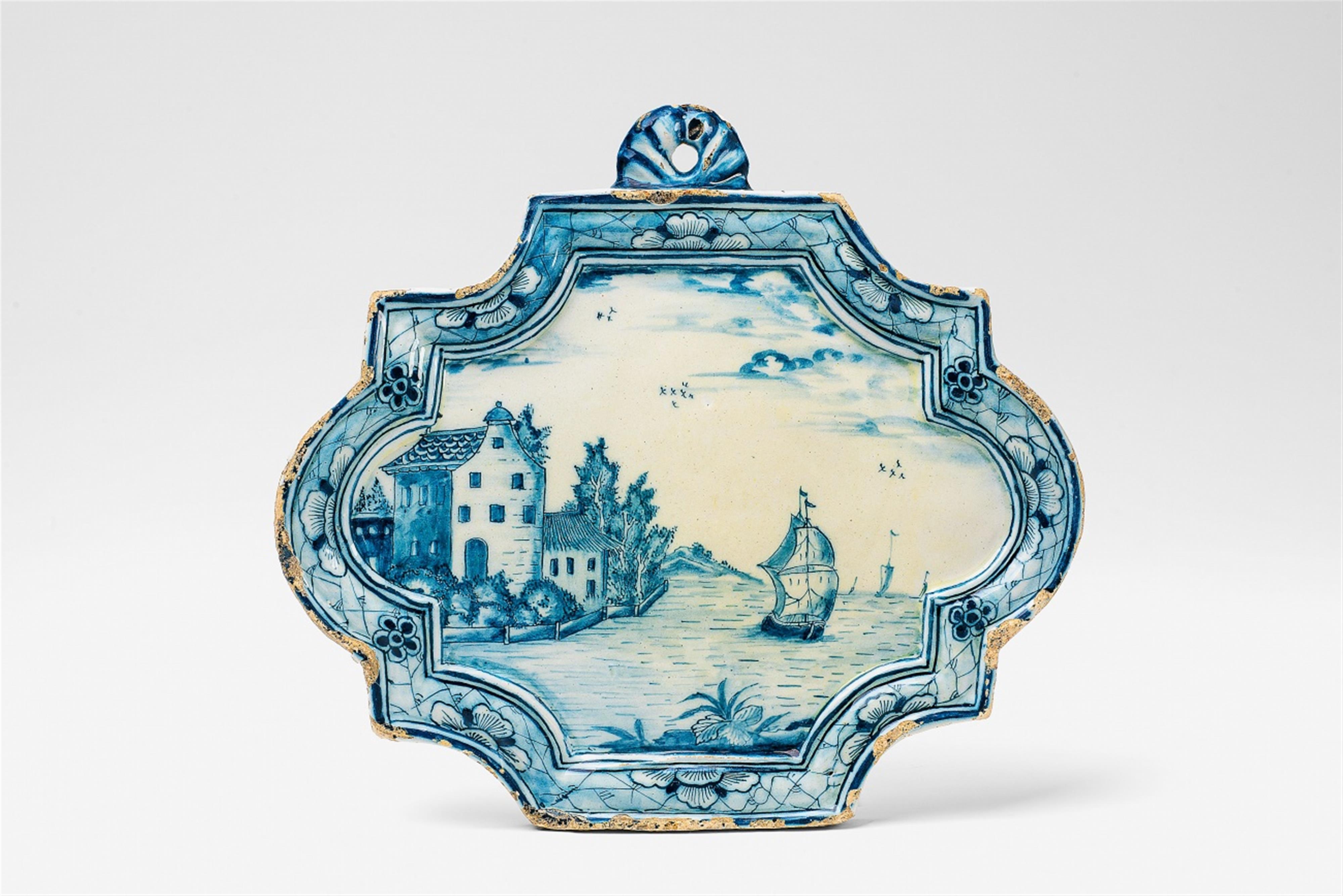 A blue and white Delft faience plaque with a river landscape - image-1